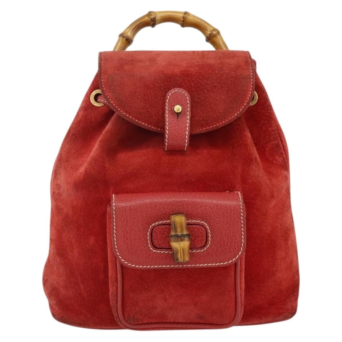 Red Suede Gucci Bamboo Backpack for Women: Red Suede Gucci Bamboo Backpack for Women This Gucci bamboo backpack is crafted from red suede and designed for women. It features a classic bamboo handle and adjustable shoulder straps. The bag shows