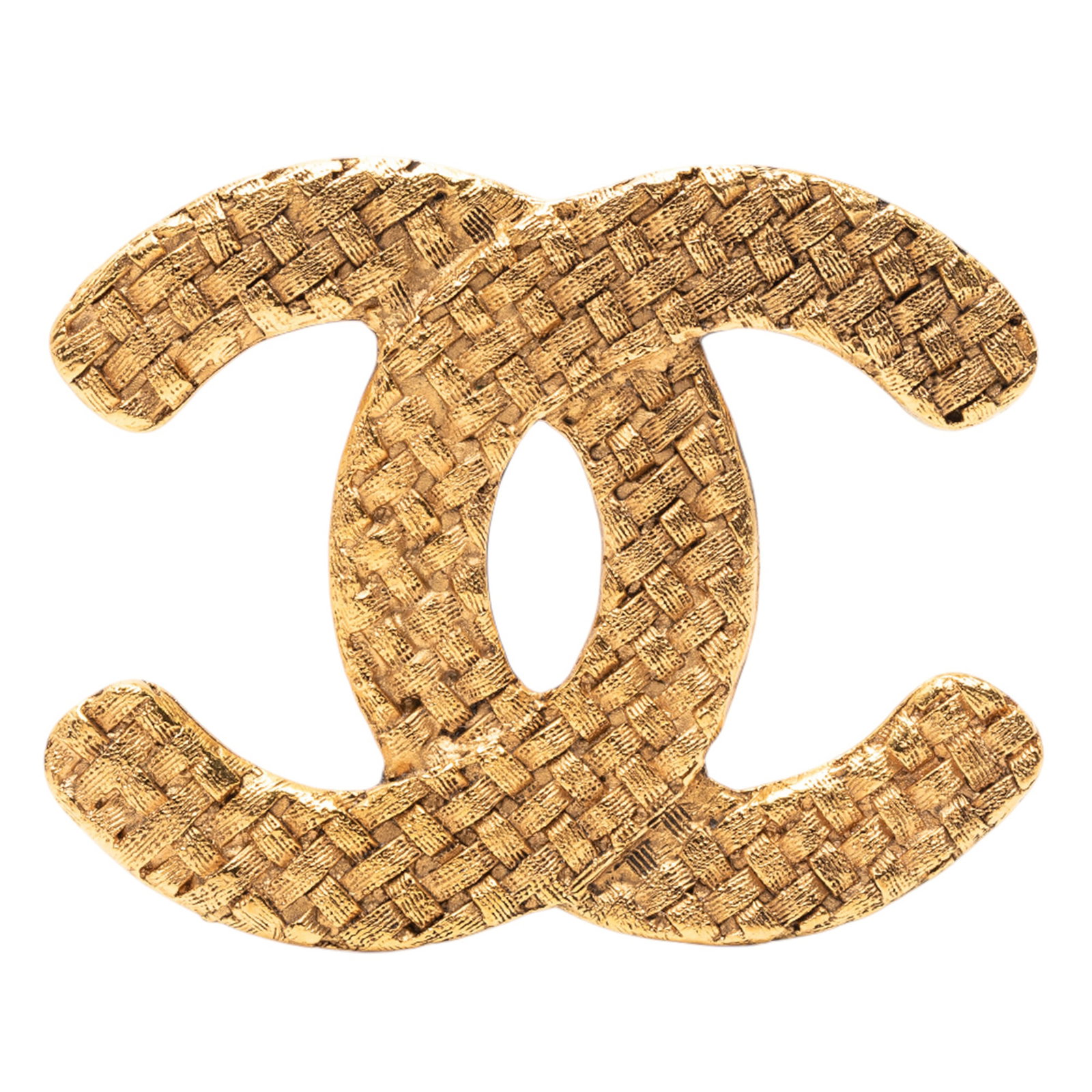 Chanel Woven Metal Brooch with Gold Tone CC Logo: Chanel Woven Metal Brooch with Gold Tone CC Logo This Chanel brooch features a woven design crafted from gold-tone metal and is secured with a back pin closure. The brooch displays the iconic CC motif