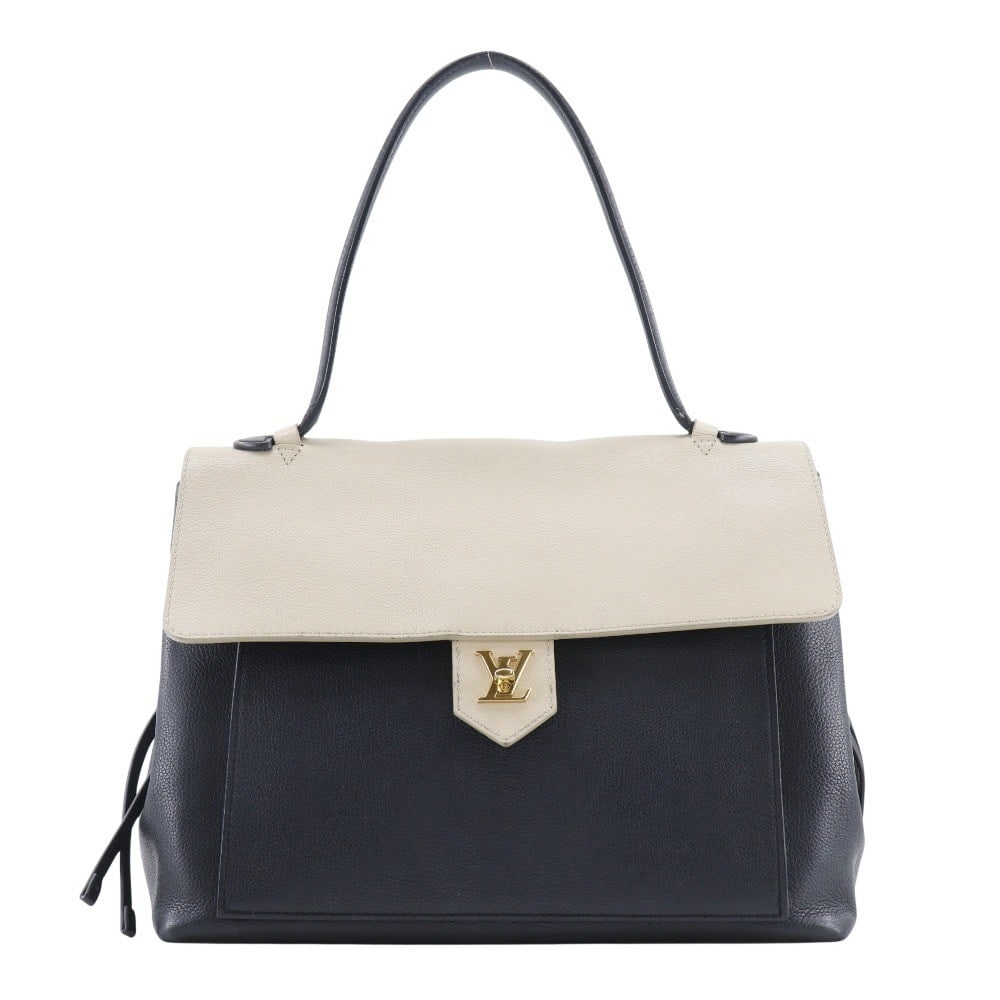 Black Leather Lockme Shoulder Bag by Louis Vuitton: Black Leather Lockme Shoulder Bag by Louis Vuitton The Louis Vuitton Lockme Handbag is crafted from black leather and designed for women. This handbag features a spacious interior with minor signs of 