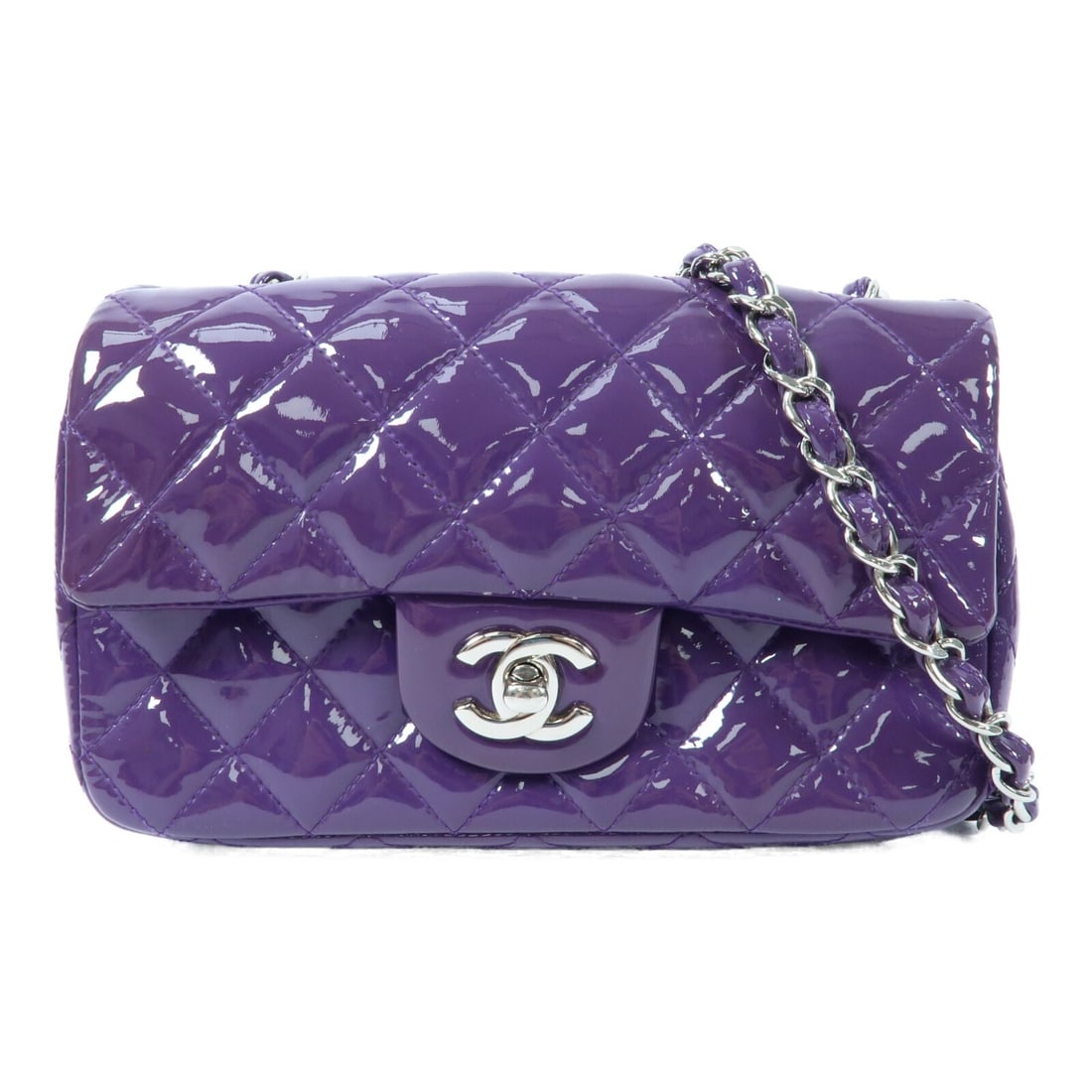 Chanel Mini Classic Purple Patent Leather Chain Shoulder Bag with Silver Hardware: Chanel Mini Classic Purple Patent Leather Chain Shoulder Bag with Silver Hardware This CHANEL Mini Classic 20 chain shoulder bag features a purple patent leather exterior with a CC logo and silver-ton