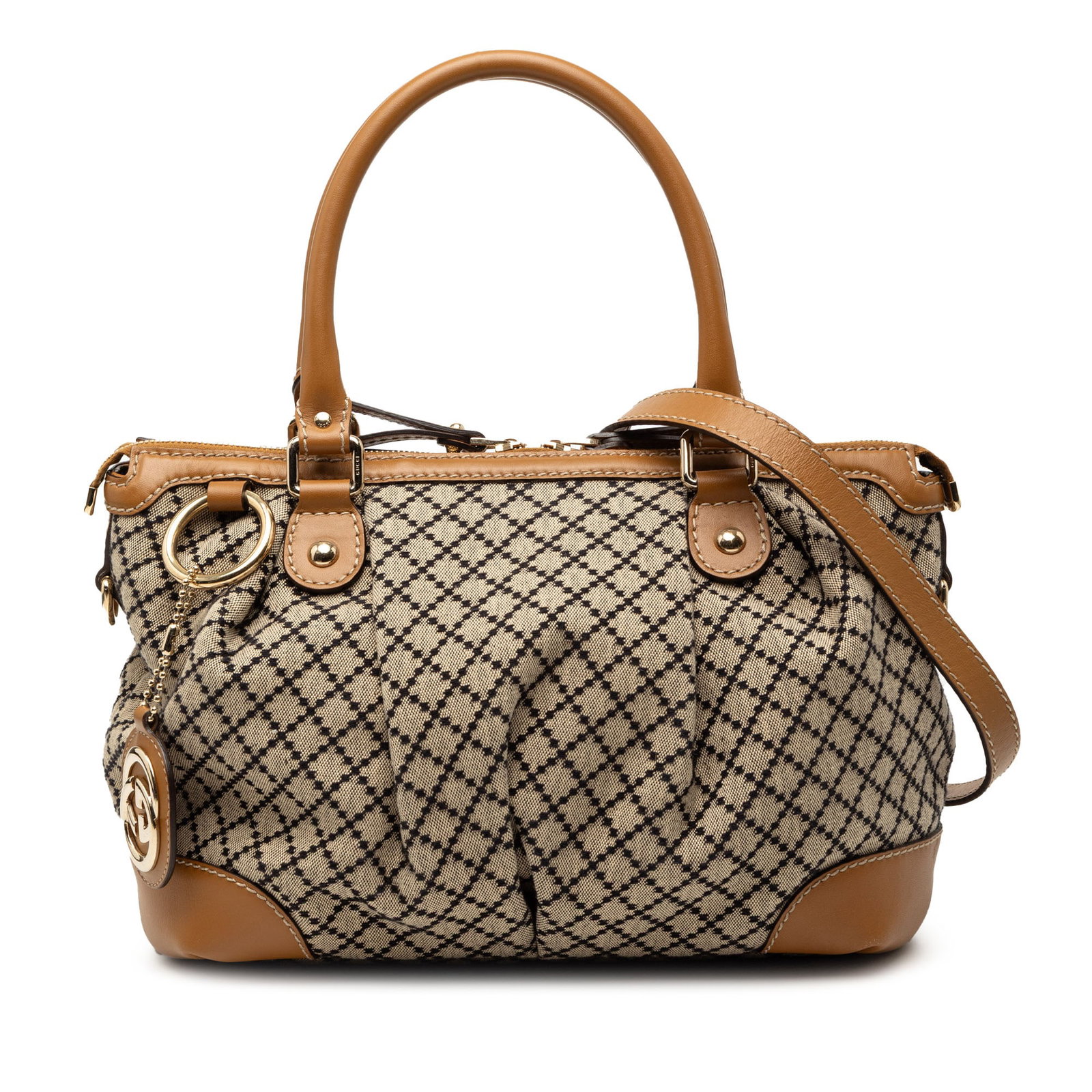 Beige Diamante Canvas Sukey Satchel by Gucci with Leather Trim: Beige Diamante Canvas Sukey Satchel by Gucci with Leather Trim The Gucci Diamante Canvas Sukey Satchel features a beige canvas body with leather trim, rolled leather handles, and a detachable flat lea