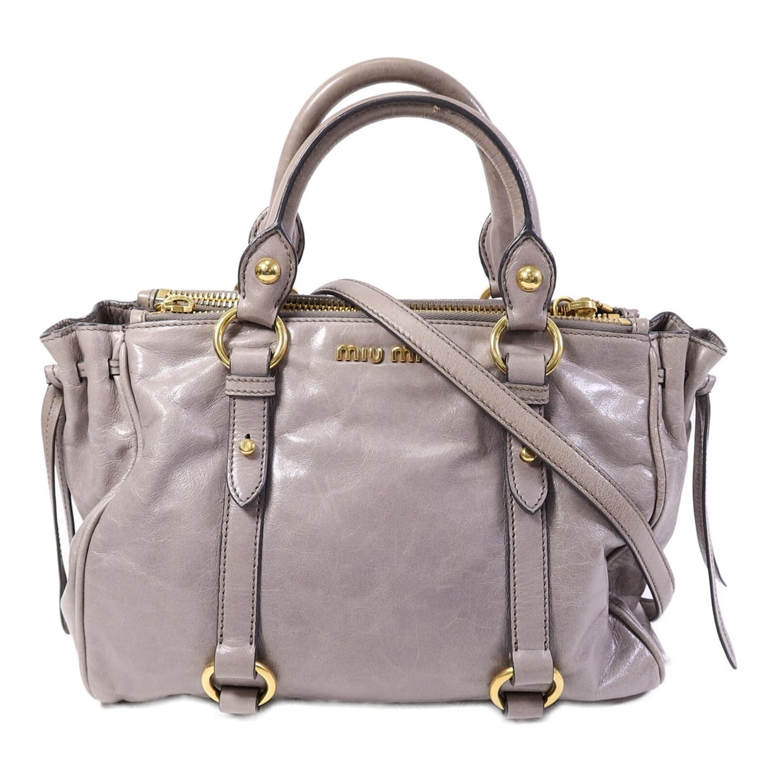 Miu Miu Calfskin Gray 2 Way Shoulder Bag GHW: Miu Miu Calfskin Gray 2 Way Shoulder Bag GHW This Miu Miu 2-way shoulder bag is crafted from high-quality calfskin leather in a sophisticated grey color. Designed for versatility, it can be worn as a 