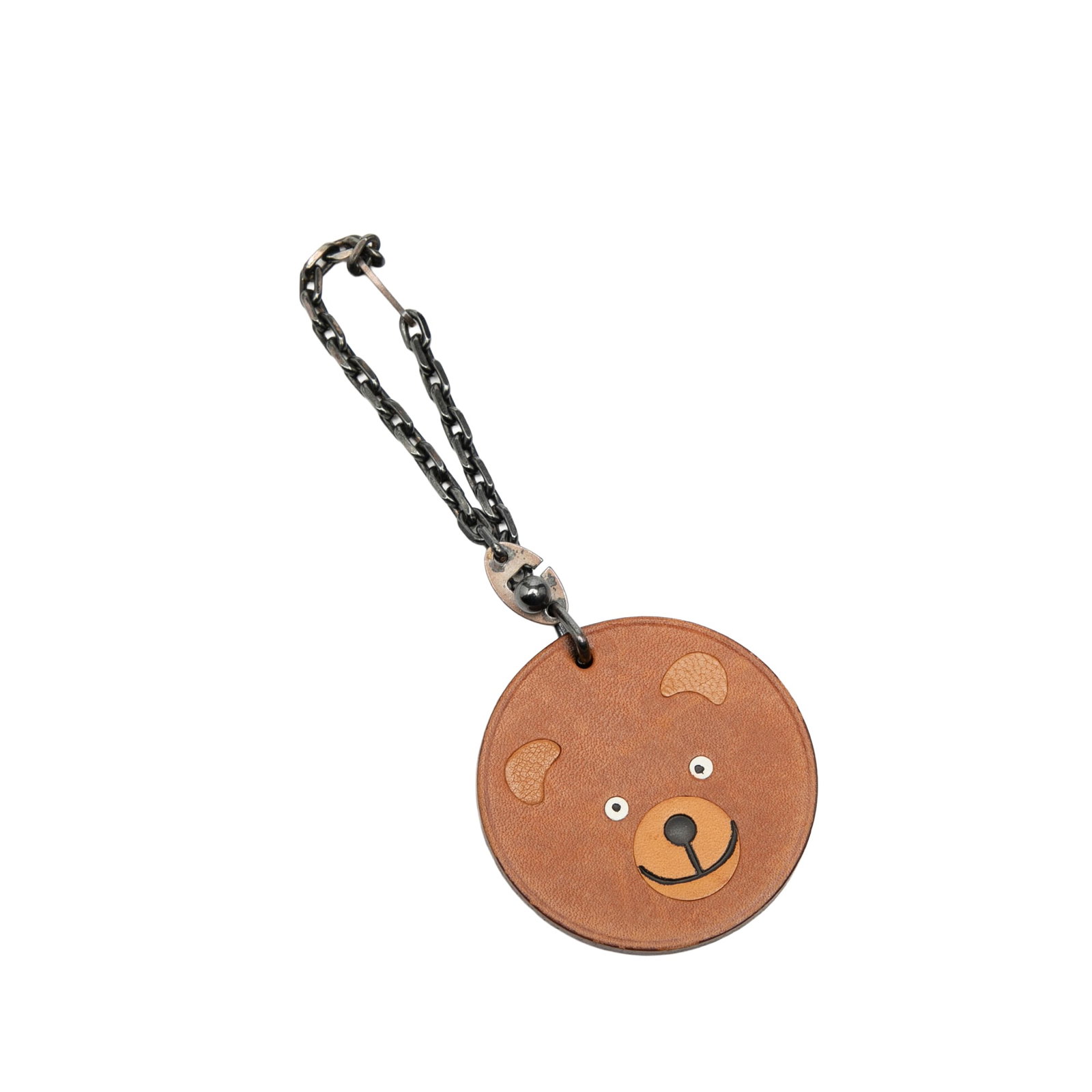 Brown Leather Bear-Shaped Bag Charm with Silver-Tone Strap by Hermes: Brown Leather Bear-Shaped Bag Charm with Silver-Tone Strap by Hermes This Hermes bag charm features a brown leather bear design with a silver-tone metal strap. The accessory shows signs of wear, inclu
