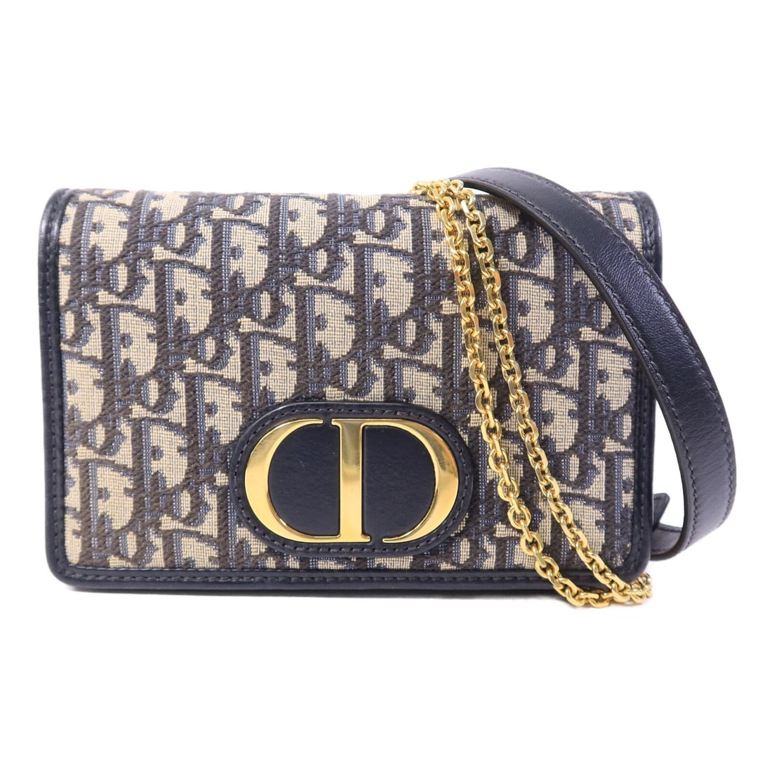 Dior 30 Montaigne Blue Canvas Shoulder Bag with Gold Hardware: Dior 30 Montaigne Blue Canvas Shoulder Bag with Gold Hardware This Christian Dior 30 Montaigne pouch features a blue canvas exterior and gold tone hardware. Designed as a shoulder bag, it offers versa