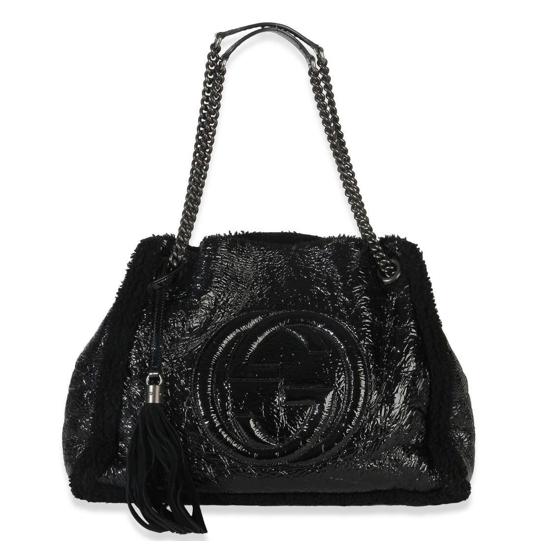 Black Patent Leather Medium Soho Hobo Shoulder Bag with Tassels by Gucci: Black Patent Leather Medium Soho Hobo Shoulder Bag with Tassels by Gucci This Gucci Medium Soho Hobo shoulder bag features black patent leather with shearling accents and silver-tone hardware. The ope