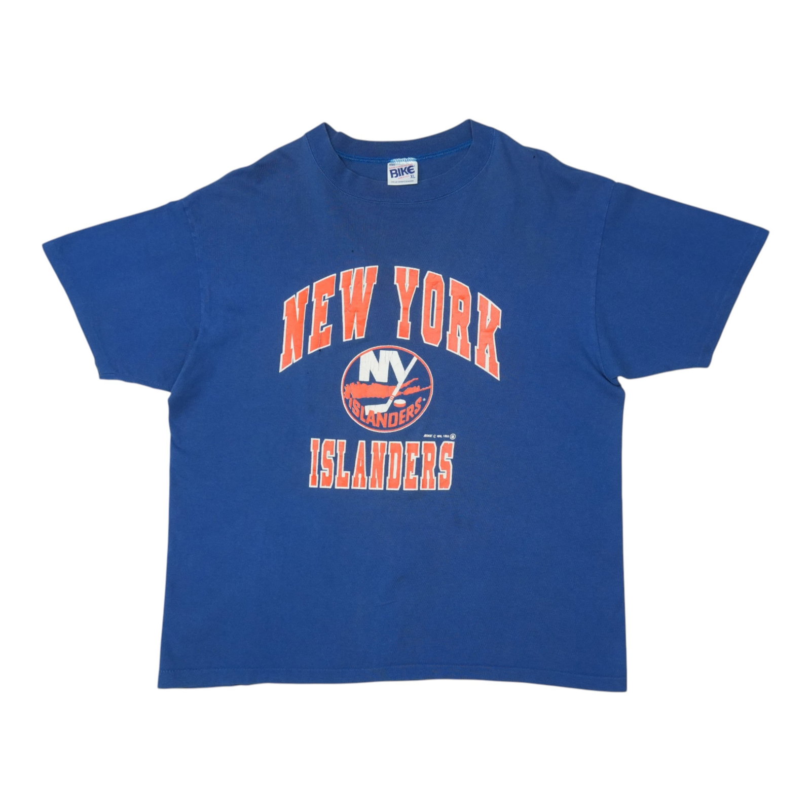 Vintage 1993 Blue New York Islanders Cotton T-Shirt Extra Large: Vintage 1993 Blue New York Islanders Cotton T-Shirt Extra Large This is an original vintage 1993 New York Islanders shirt, not a modern reproduction. Made of 100% cotton and featuring a blue color, th