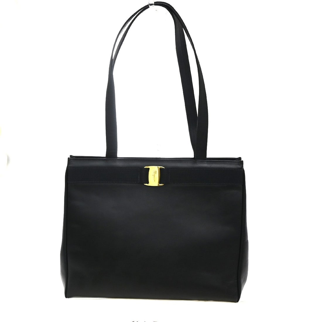Black Leather Vala Tote Bag by Salvatore Ferragamo: Black Leather Vala Tote Bag by Salvatore Ferragamo This Salvatore Ferragamo Vala tote features a black leather exterior and is designed for women. Crafted in Italy, the bag displays signs of previous 