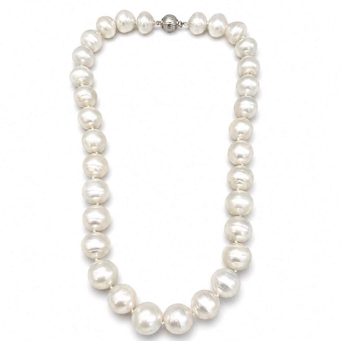 South Sea Pearl Strand with Silver Clasp 19 Inch 33 Pearls: South Sea Pearl Strand with Silver Clasp 19 Inch 33 Pearls This graduated South Sea pearl necklace features 33 lustrous pearls ranging in size from 15.9 mm to 12.6 mm. The necklace is secured with a s