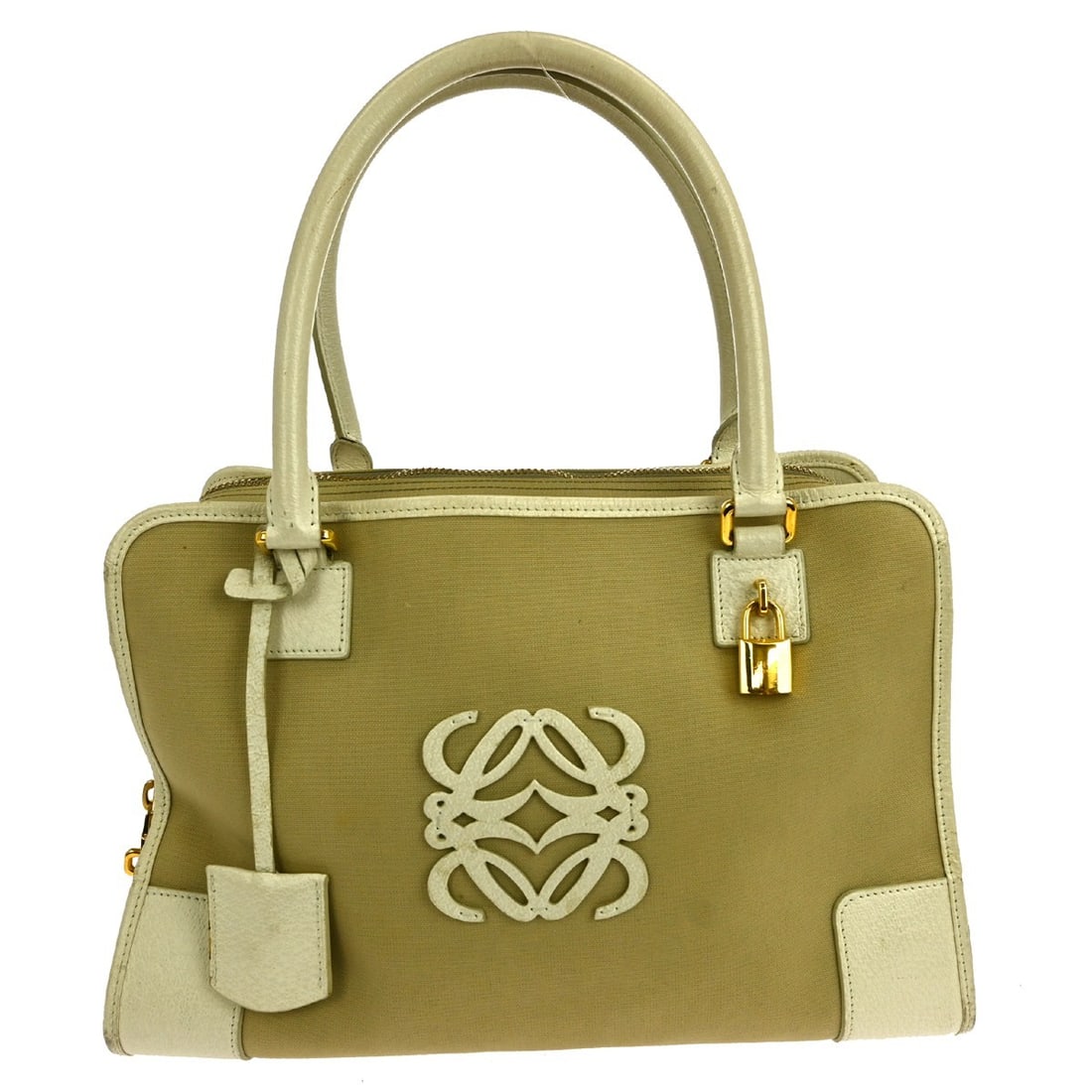Loewe Fusta beige canvas leather tote handbag: Loewe Fusta beige canvas leather tote handbag This Loewe Fusta tote handbag features a beige canvas leather exterior with double leather handles and a magnetic closure. The medium-sized bag offers pra