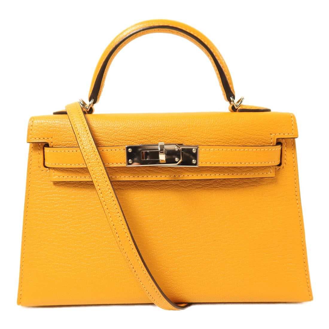 Hermes Mini Kelly Chevre Goatskin Yellow Handbag PHW: Hermes Mini Kelly Chevre Goatskin Yellow Handbag PHW This Hermes Mini Kelly handbag is crafted from luxurious goatskin leather in a vibrant yellow shade, known as Jaune Ambre. Designed for women, it f