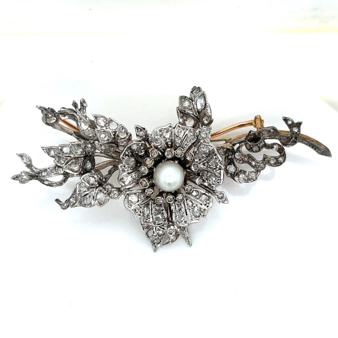 Antique French Rose Cut Diamond Brooch in 18K Gold and Silver: Antique French Rose Cut Diamond Brooch in 18K Gold and Silver This Victorian French brooch is crafted from 18K yellow gold with a silver top and is set with approximately 4.50 carats of rose-cut diamo