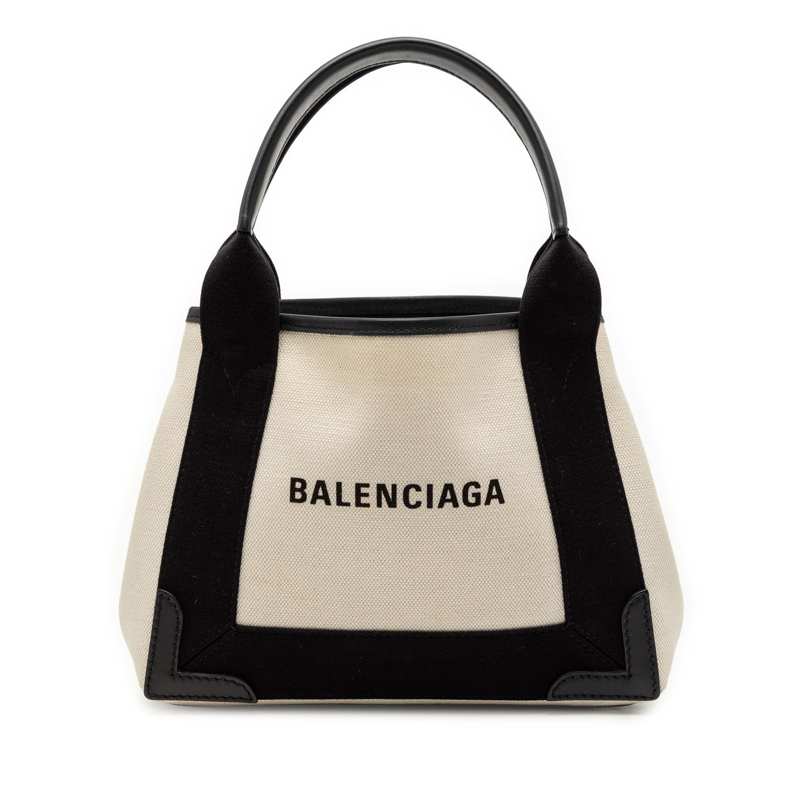 Balenciaga Canvas Navy Cabas XS Tote Bag with Leather Trim and Pouch: Balenciaga Canvas Navy Cabas XS Tote Bag with Leather Trim and Pouch This Balenciaga Canvas Navy Cabas XS features a white canvas body accented with leather trim and flat leather handles. It offers an
