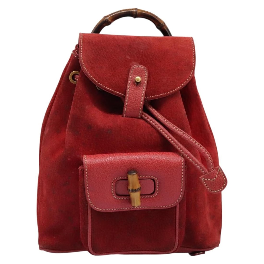 Red Suede Gucci Bamboo Backpack for Women 21cm x 22cm x 6cm: Red Suede Gucci Bamboo Backpack for Women 21cm x 22cm x 6cm This Gucci bamboo backpack is crafted from red suede and designed for women. Made in Italy, it features the iconic bamboo handle and a struc