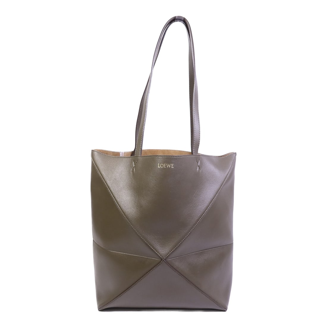 LOEWE Puzzle Fold Medium Green Calfskin Tote Bag: LOEWE Puzzle Fold Medium Green Calfskin Tote Bag This LOEWE Puzzle Fold Tote Medium features a distinctive design crafted from green calfskin leather. The tote offers a spacious interior, making it bo