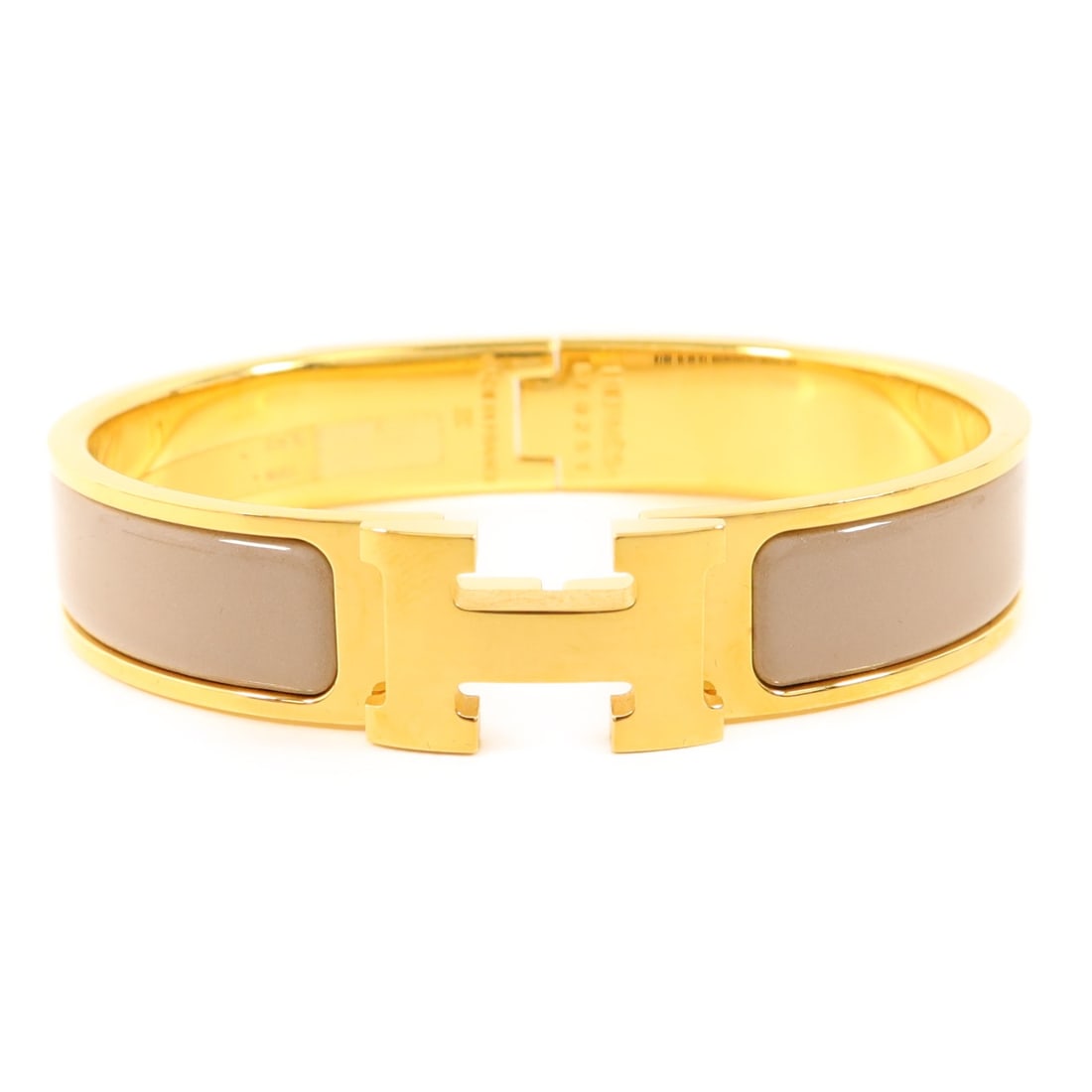 Hermes Clic H Bangle Bracelet with Gold Tone Hardware in Gray: Hermes Clic H Bangle Bracelet with Gold Tone Hardware in Gray Hermes Clic H bangle bracelet designed for women. This bracelet features a gray color and is crafted from metal with a gold tone finish. M