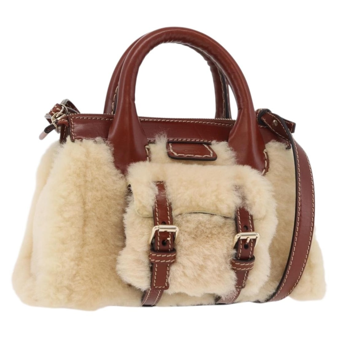 Chloe fur beige gold 2way handbag with shoulder strap: Chloe fur beige gold 2way handbag with shoulder strap This Chloe Edith handbag is crafted from fur and features a versatile 2-way design in beige and gold tones. The bag includes both a top handle and