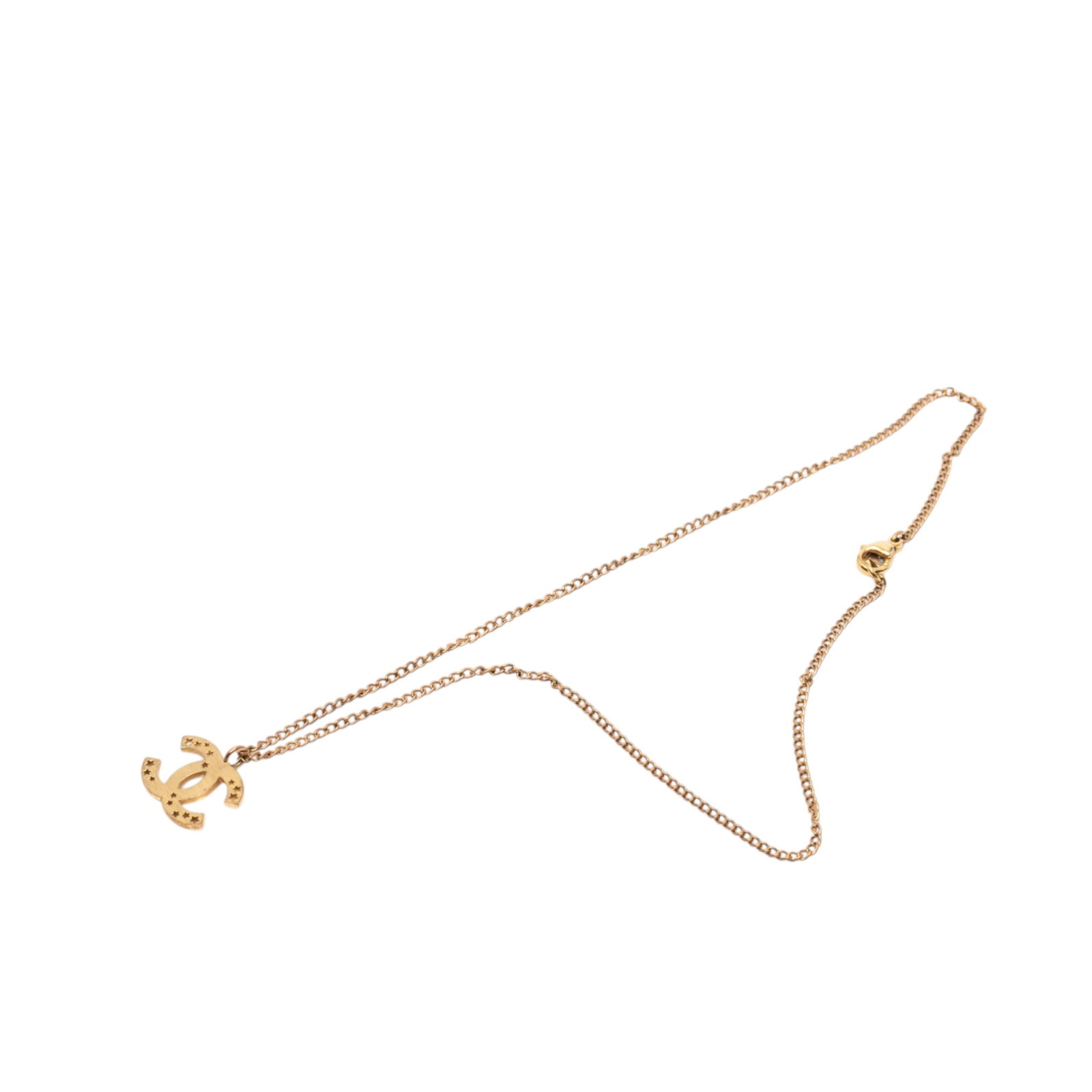 Chanel CC Star Pendant Necklace in Gold Plated Metal: Chanel CC Star Pendant Necklace in Gold Plated Metal This Chanel necklace features a gold-plated metal body and a pendant adorned with a punched star detail. It is secured with a lobster clasp closure