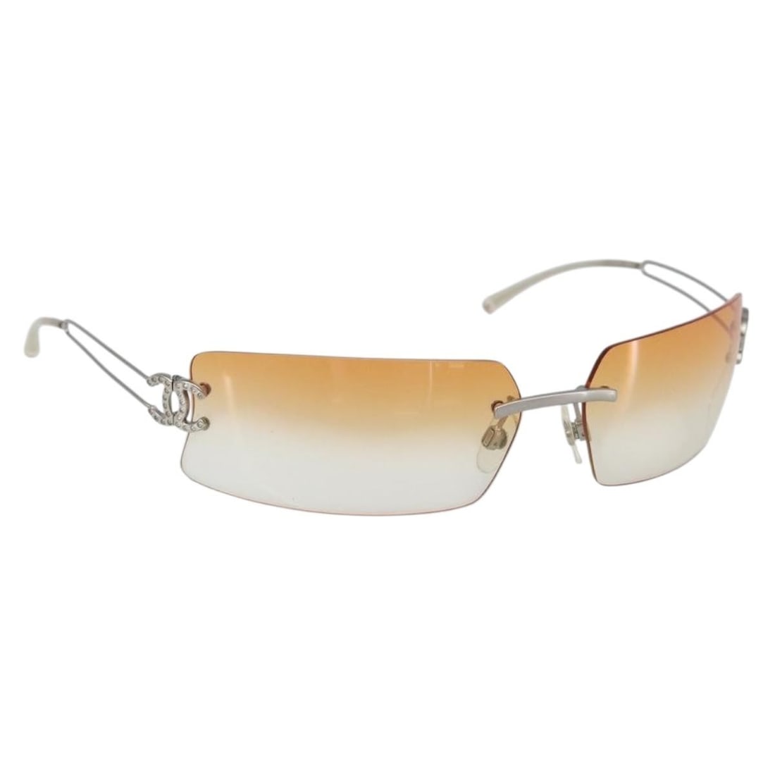 Chanel Metal Sunglasses with Signature CC Logo Silver Frame: Chanel Metal Sunglasses with Signature CC Logo Silver Frame These Chanel Logo CC sunglasses feature a silver metal frame designed for women. The pre-owned sunglasses are in good condition with minor s