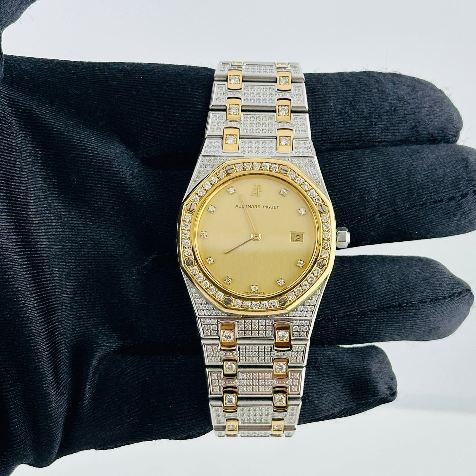 Royal Oak Ladies Watch 56303SA Diamond Champagne Dial and Bracelet: Royal Oak Ladies Watch 56303SA Diamond Champagne Dial and Bracelet This Audemars Piguet Royal Oak ladies watch features a champagne dial adorned with diamonds, complemented by a diamond-set bezel and 