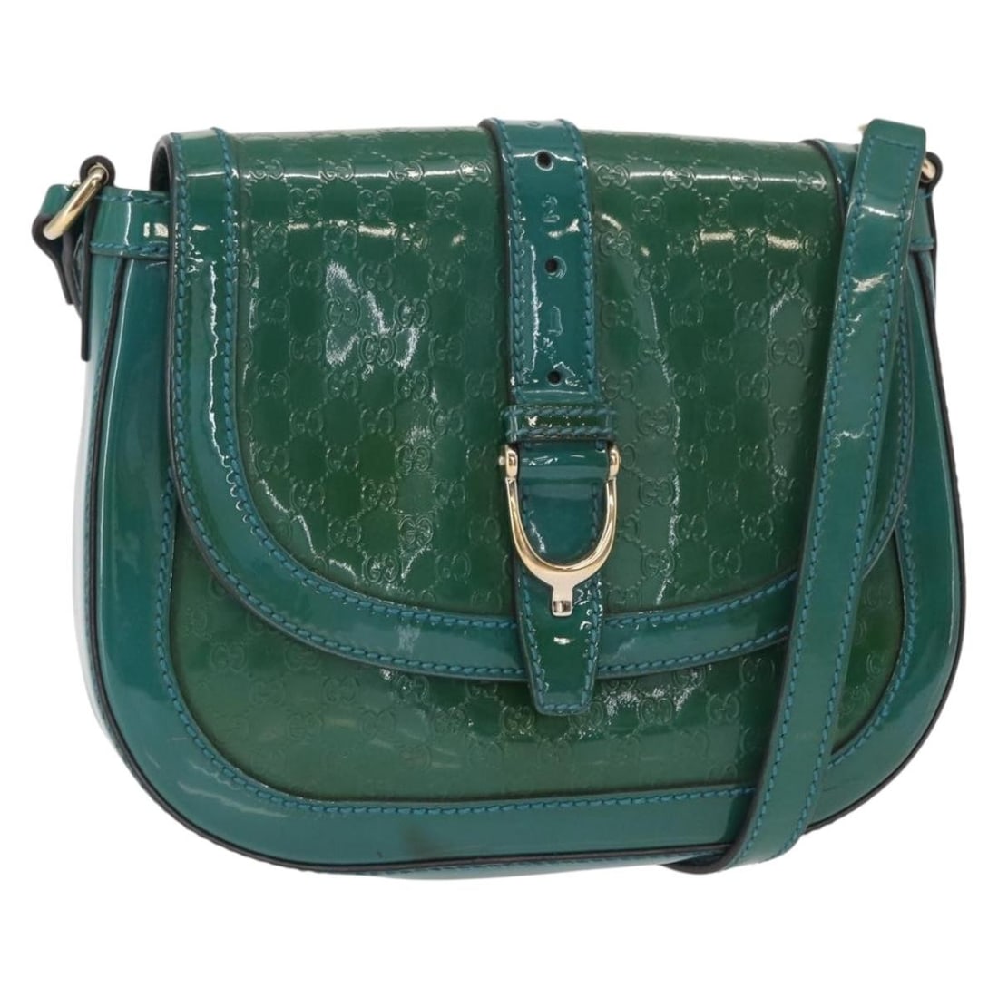 Turquoise Patent Leather Gucci Vintage Shoulder Bag with Flap: Turquoise Patent Leather Gucci Vintage Shoulder Bag with Flap This Gucci Vintage Flap Shoulder Bag is crafted from turquoise patent leather and features a classic flap design. Designed for women, it o