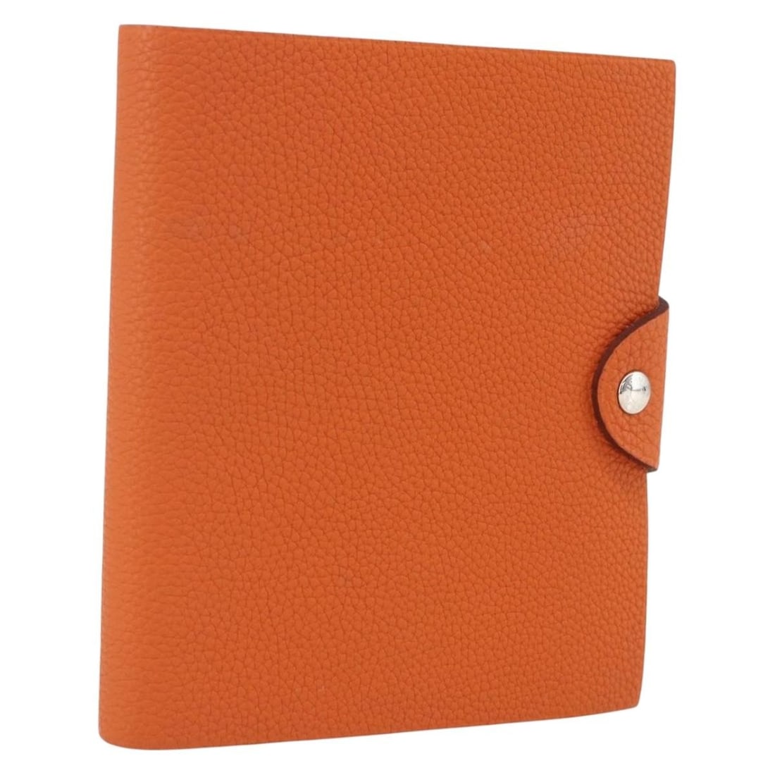 Hermes Orange Leather Ulysse Unisex Agenda Cover 13cm x 6cm x 2cm: Hermes Orange Leather Ulysse Unisex Agenda Cover 13cm x 6cm x 2cm The Hermes Ulysse Agenda Cover is a unisex planner crafted from orange leather. It features a compact design suitable for daily use an