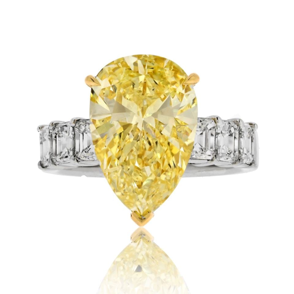 4.73 Carat GIA Certified Fancy Yellow Diamond Engagement Ring: 4.73 Carat GIA Certified Fancy Yellow Diamond Engagement Ring This stunning Fancy Yellow Diamond Engagement Ring is a true masterpiece, designed to celebrate your love story with its exceptional beaut