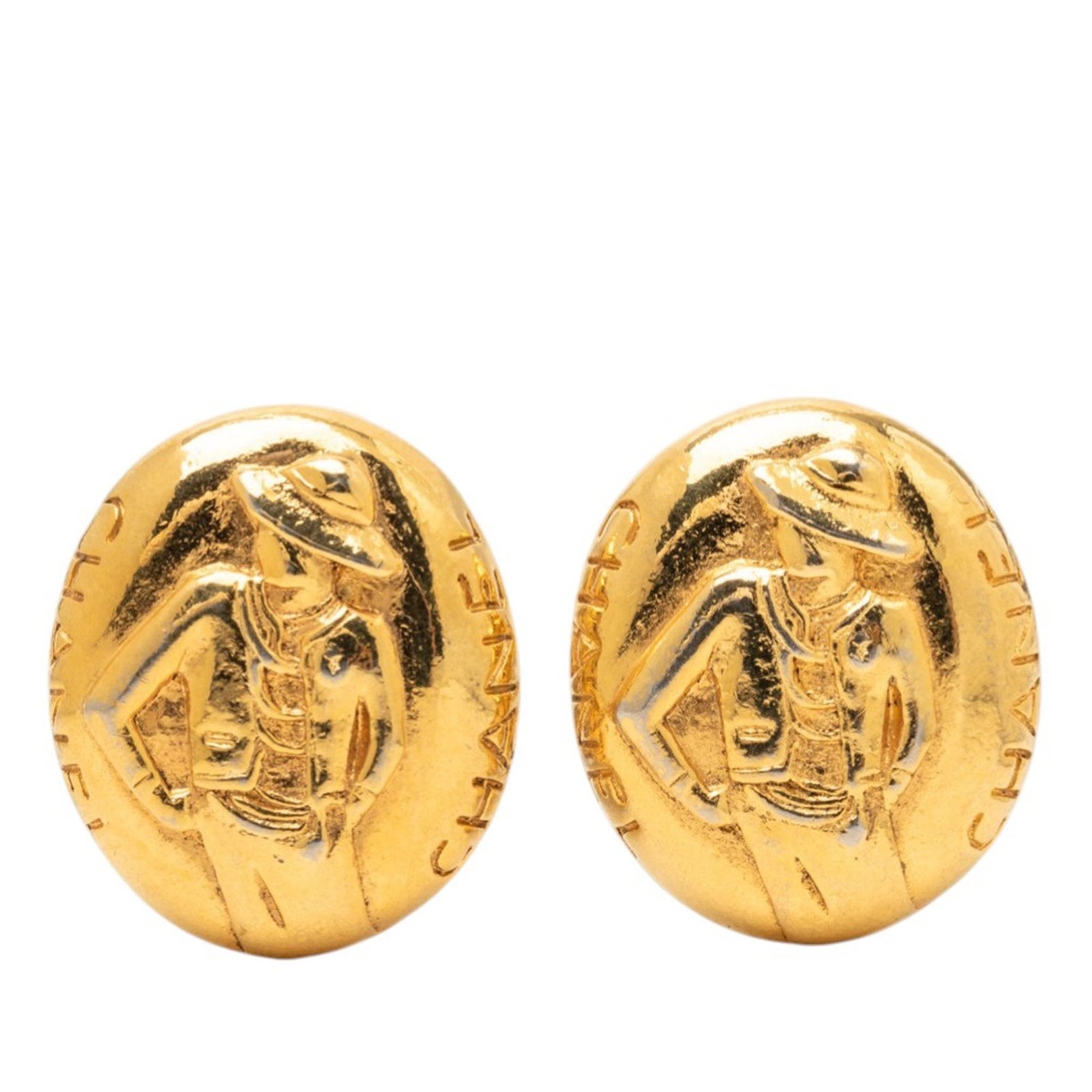 Chanel Mademoiselle Gold Plated Clip On Logo Earrings: Chanel Mademoiselle Gold Plated Clip On Logo Earrings These Chanel clip-on earrings feature gold-plated metal bodies adorned with the iconic Mademoiselle logo. Designed as costume jewelry, they showca
