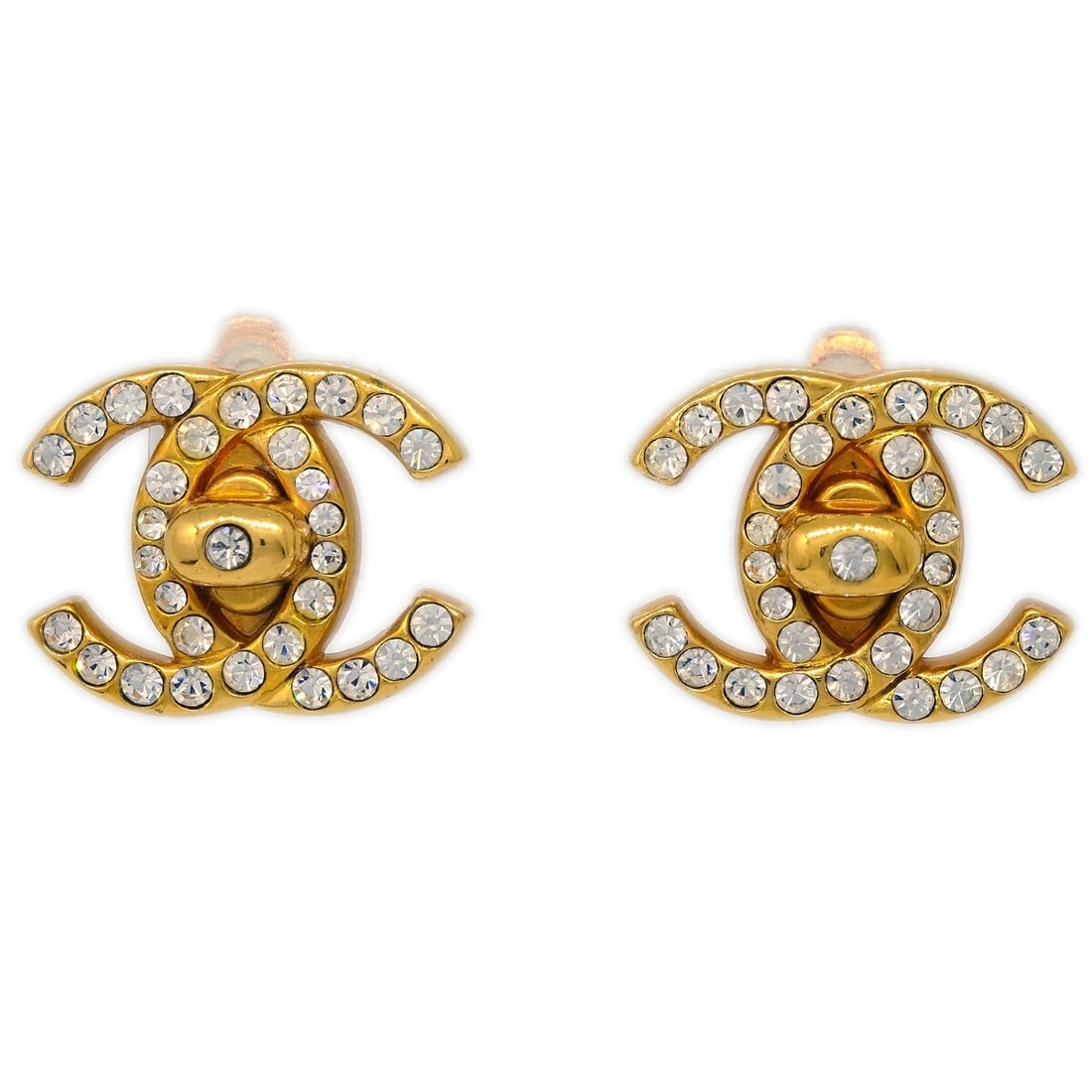 Chanel Gold Plated CC Clip On Rhinestone Earrings 96A: Chanel Gold Plated CC Clip On Rhinestone Earrings 96A These Chanel CC Turnlock earrings feature a classic logo design adorned with rhinestones. Crafted in France, they have a gold-plated finish and se