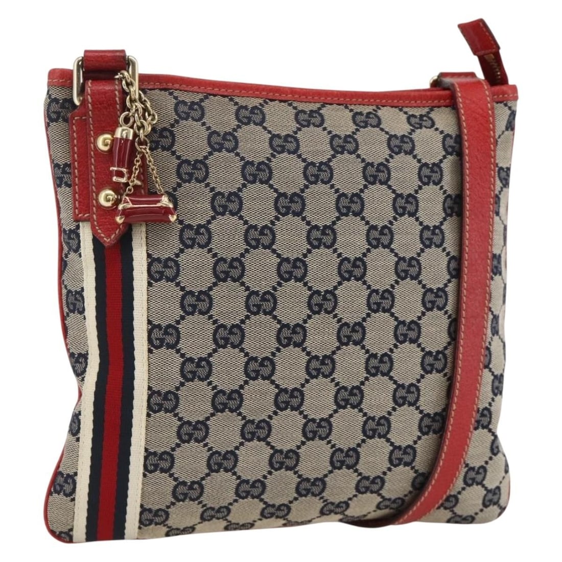 Gucci GG Canvas Navy Red Gold Sherry Line Shoulder Bag 144388: Gucci GG Canvas Navy Red Gold Sherry Line Shoulder Bag 144388 This is a Gucci GG Canvas Sherry Line shoulder bag in navy, gold, and red. Designed for women, it features the iconic GG canvas exterior w