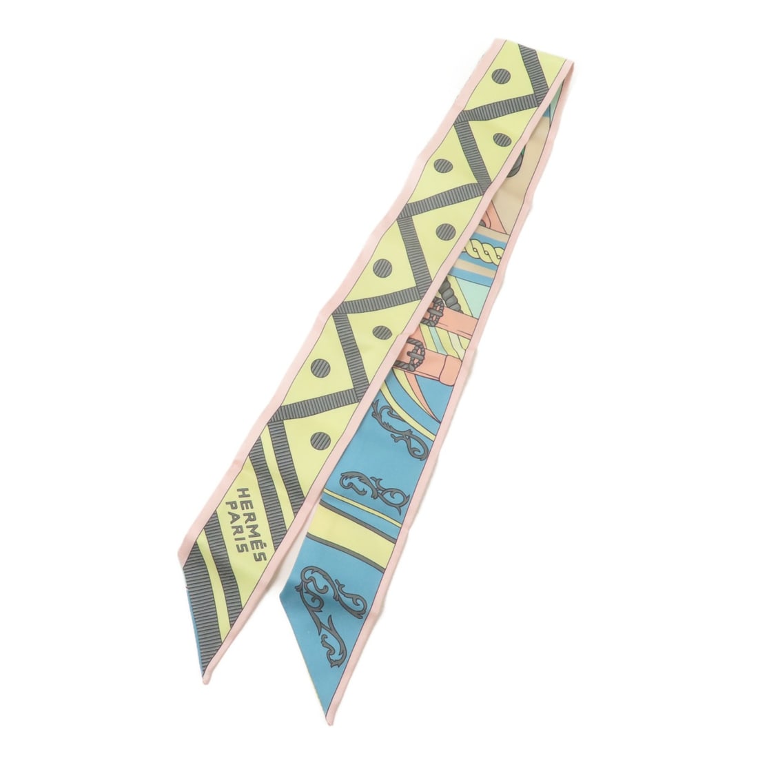 Hermes Twilly silk multicolor women's scarf: Hermes Twilly silk multicolor women's scarf This HERMES Twilly scarf features a vibrant multicolor design crafted from luxurious silk. Designed for women, this elegant accessory showcases the brand's 
