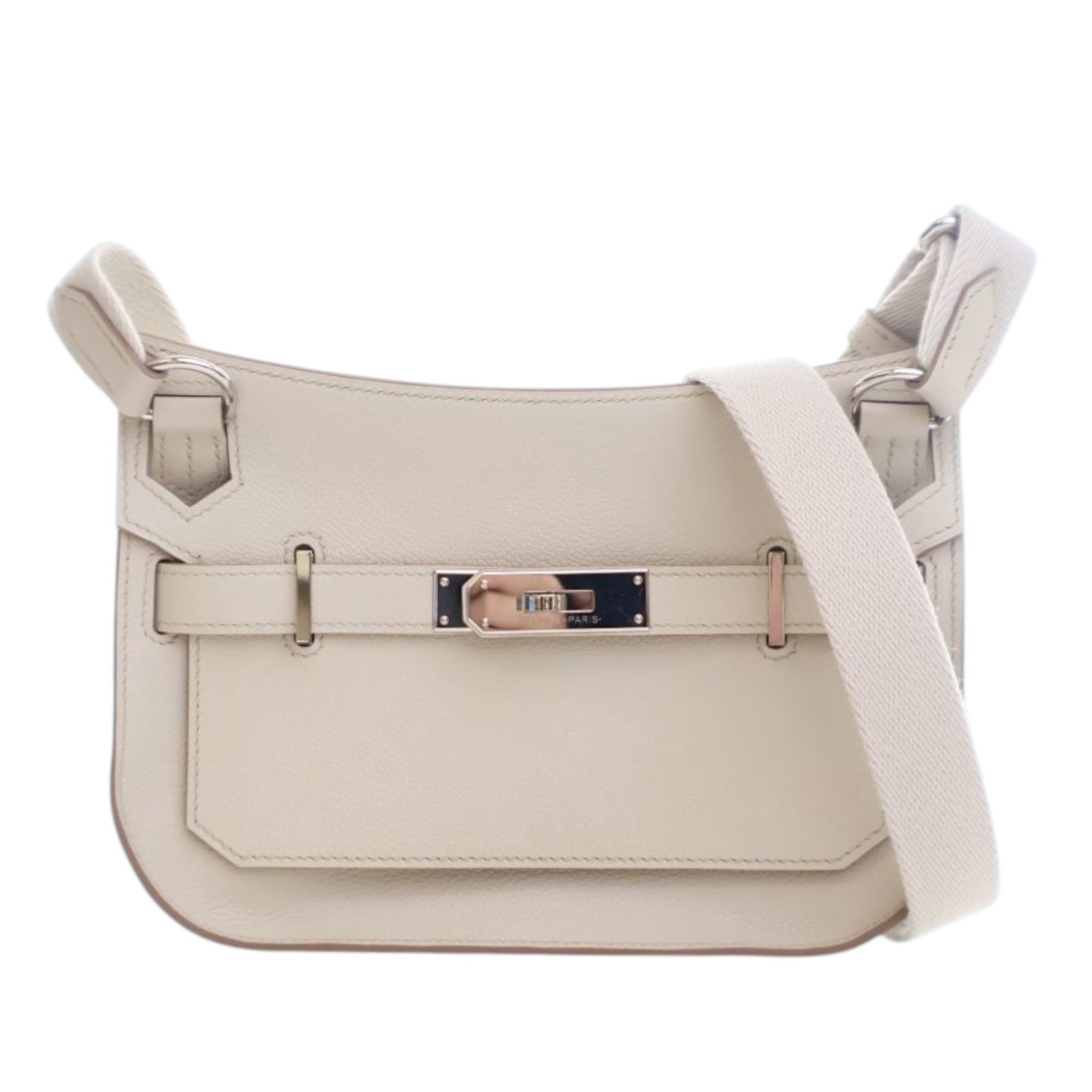 Hermes Mini Jypsiere Crossbody Bag in Evercolor Leather Beton White: Hermes Mini Jypsiere Crossbody Bag in Evercolor Leather Beton White This Hermes Mini Jypsiere bag features an Evercolor leather body in Beton color, complemented by a flat canvas strap. It is designed