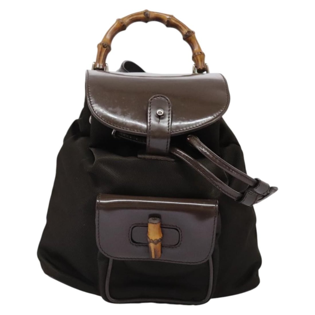 Gucci Vintage Bamboo Brown Nylon Patent Leather Backpack: Gucci Vintage Bamboo Brown Nylon Patent Leather Backpack This Gucci Vintage Bamboo Backpack is crafted from brown nylon with patent leather accents, designed for women. Made in Italy, it features the 