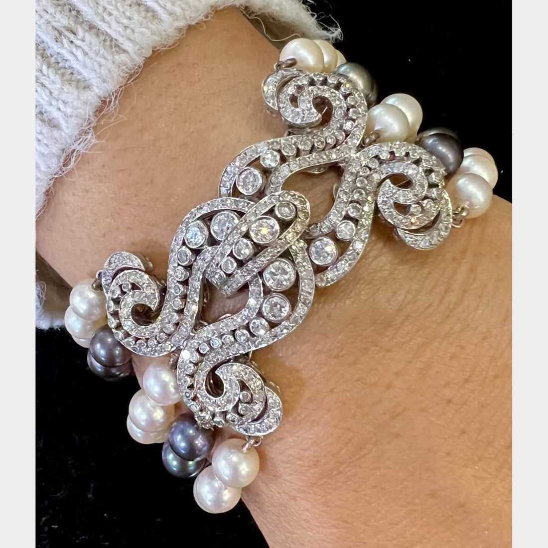 Art Deco Platinum Bracelet with 312 Diamonds and Cultured Pearls: Art Deco Platinum Bracelet with 312 Diamonds and Cultured Pearls This exquisite Art Deco bracelet is crafted from platinum and features a stunning combination of 312 diamonds and cultured pearls. The 