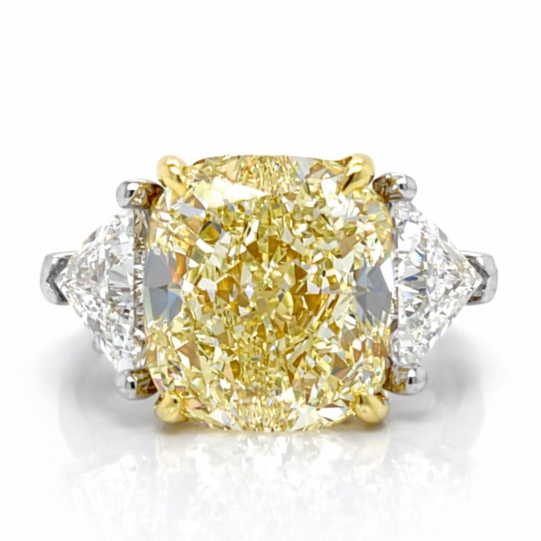 GIA 8.16 Ct Fancy Light Yellow Diamond Ring in 18K White and Yellow Gold: GIA 8.16 Ct Fancy Light Yellow Diamond Ring in 18K White and Yellow Gold This 18K white and yellow gold ring features a GIA certified 8.16 carat cushion-cut diamond with fancy light yellow color and V
