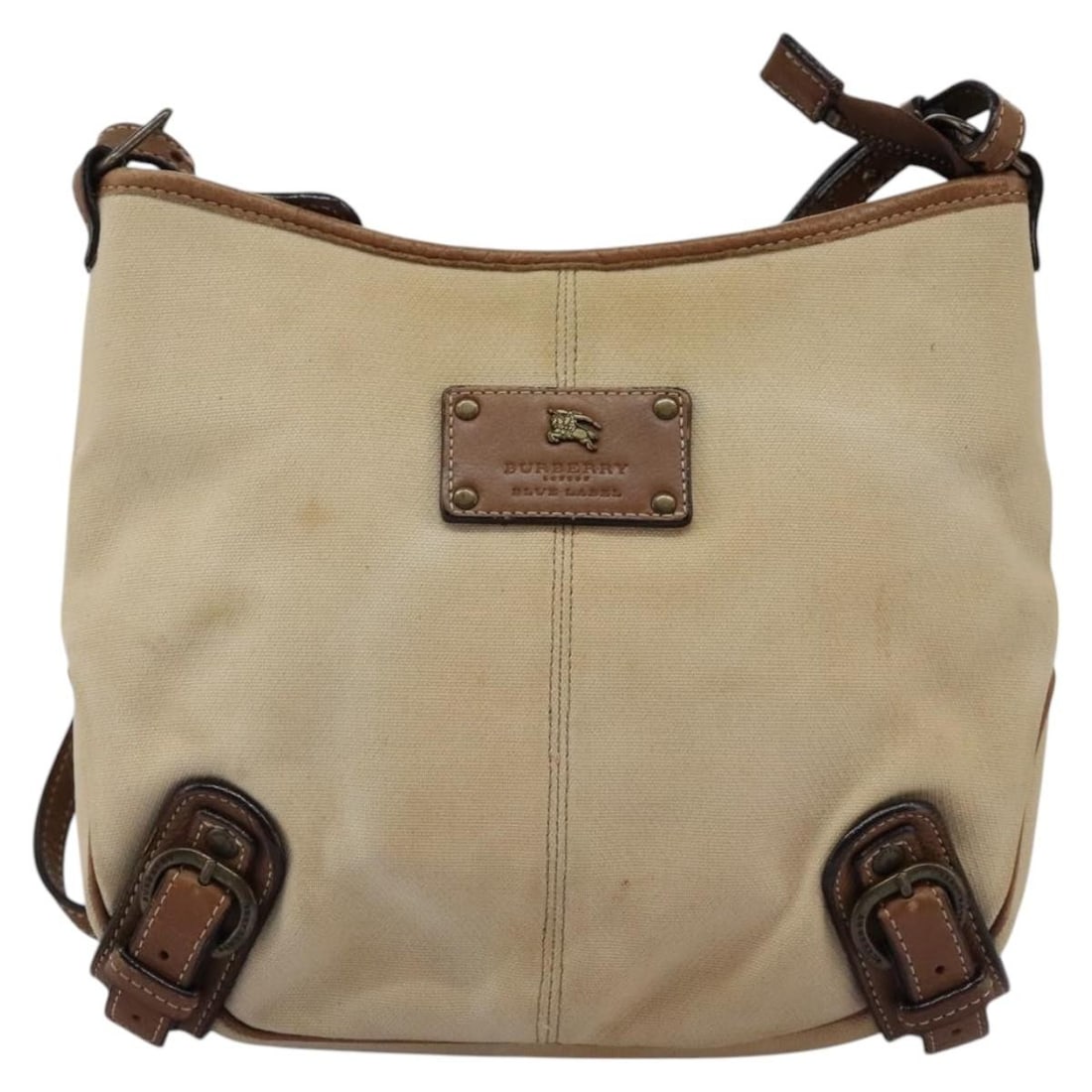Burberry Blue Label Canvas Beige Shoulder Bag for Women: Burberry Blue Label Canvas Beige Shoulder Bag for Women This Burberry Blue Label shoulder bag is crafted from beige canvas and designed for women. The bag features a structured silhouette with a shoul