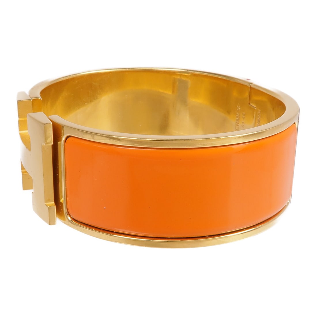 Enamel Orange Clic-Clac H Bracelet by Hermes: Enamel Orange Clic-Clac H Bracelet by Hermes This Hermes Clic-Clac H bracelet features an elegant orange enamel design with metal accents. Crafted in France, it showcases the brand's signature style a