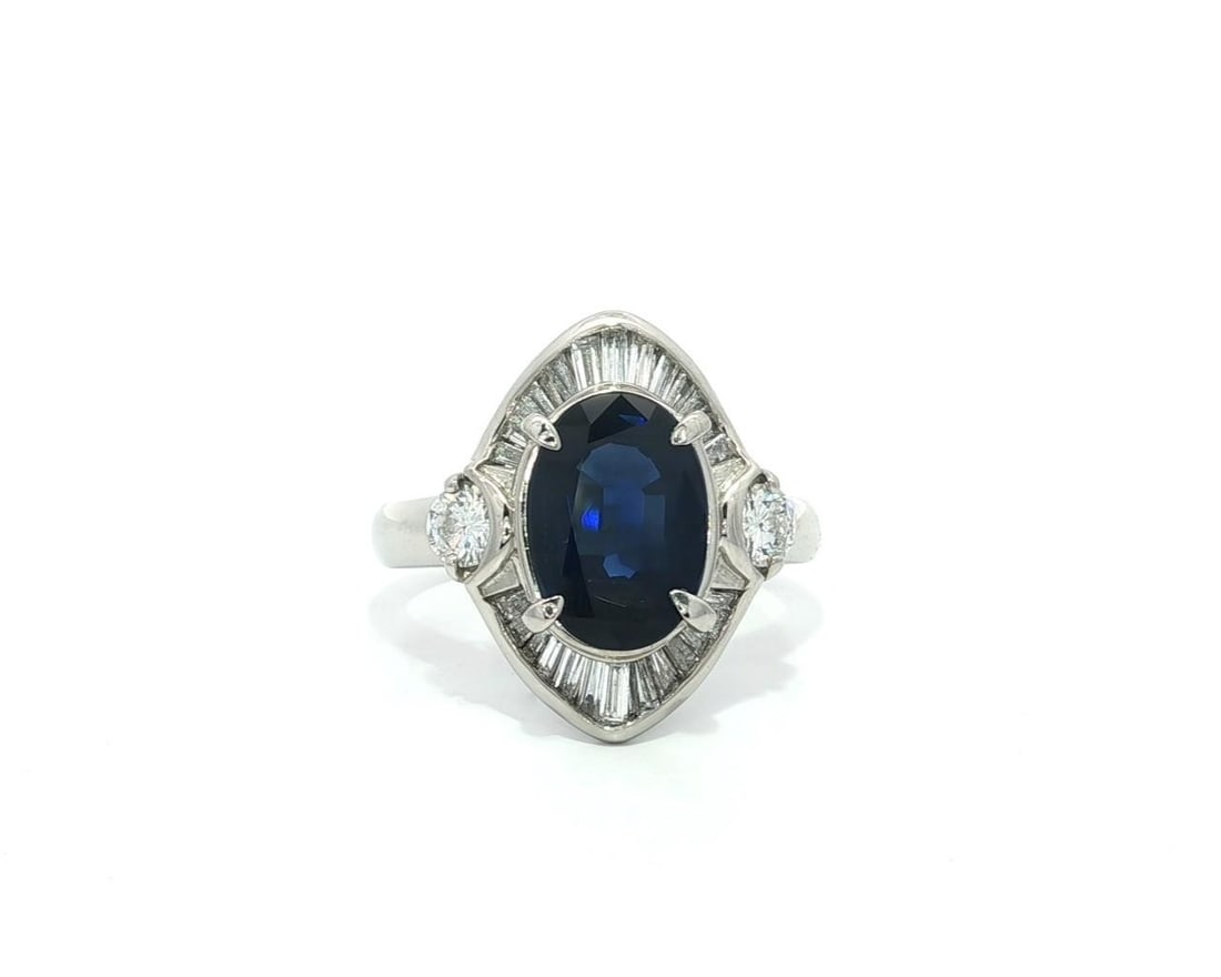 Platinum GIA Certified 4.05ct Royal Blue Sapphire Diamond Accent Ring: Platinum GIA Certified 4.05ct Royal Blue Sapphire Diamond Accent Ring This exquisite cocktail ring features a stunning natural genuine sapphire, showcasing an oval brilliant step cut in a royal blue h