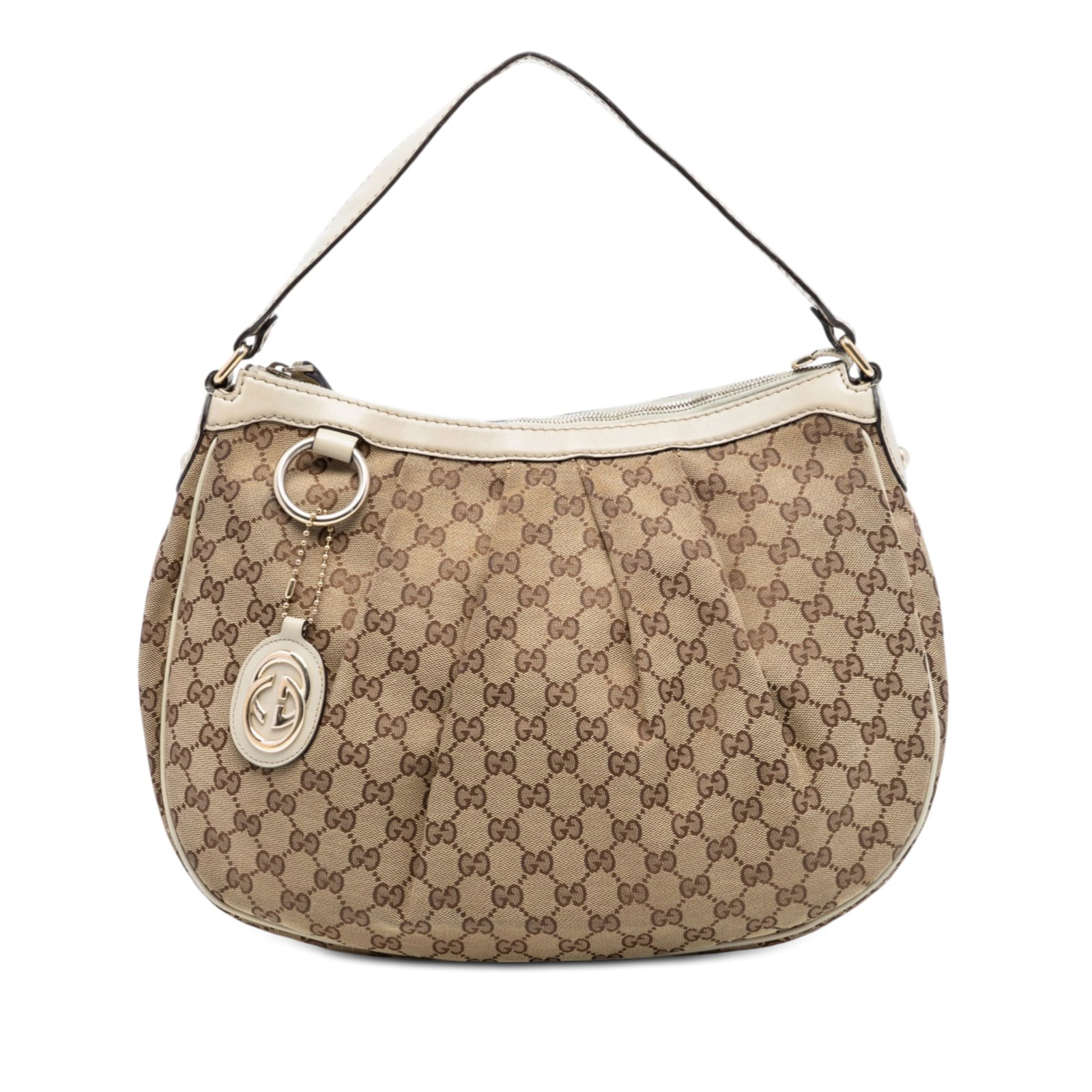 Gucci Sukey Beige GG Canvas Shoulder Bag with Leather Trim: Gucci Sukey Beige GG Canvas Shoulder Bag with Leather Trim The Gucci GG Canvas Sukey shoulder bag features a beige canvas body accented with leather trim, a flat leather strap, and a top zip closure. 