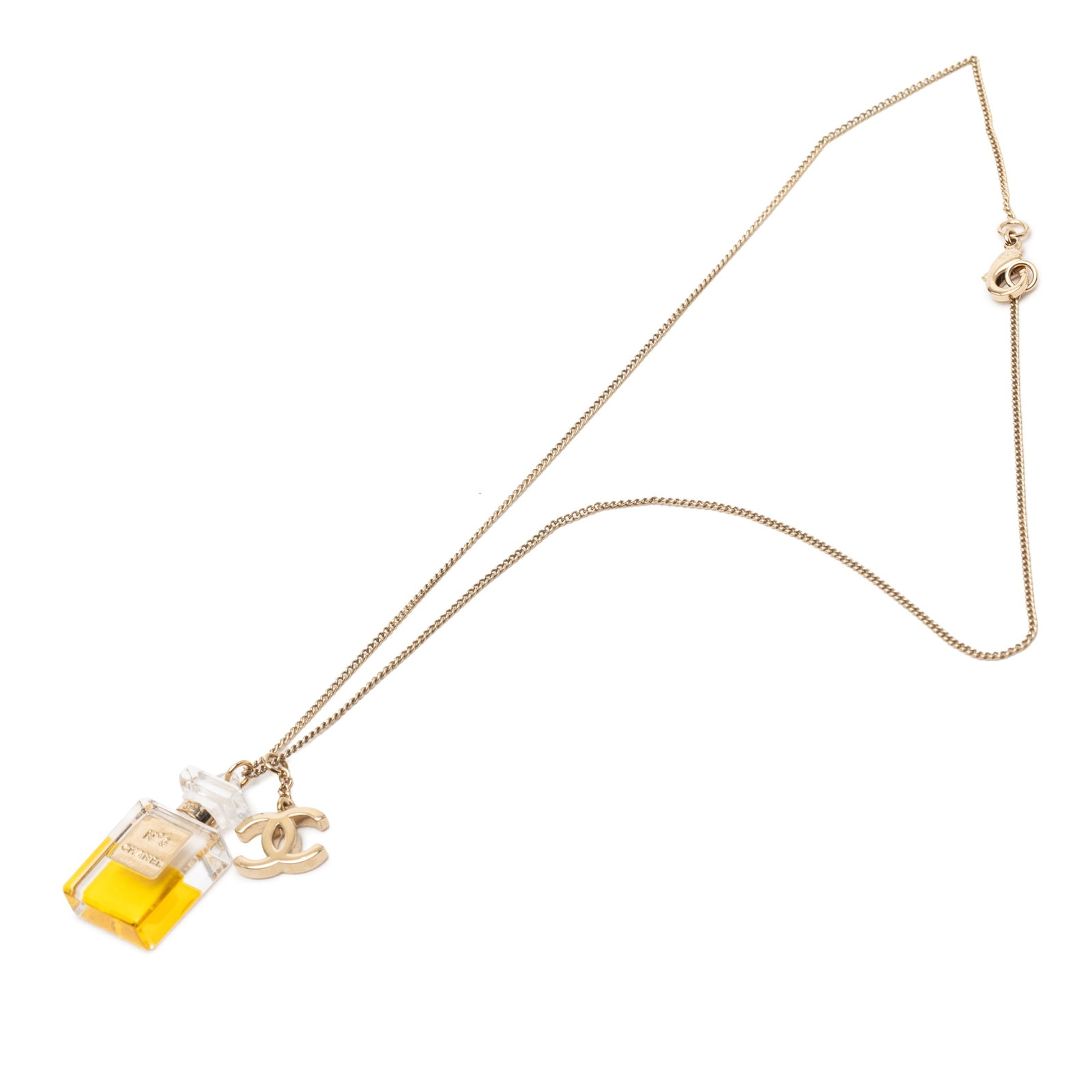 Chanel CC and No 5 Perfume Bottle Gold Plated Pendant Necklace: Chanel CC and No 5 Perfume Bottle Gold Plated Pendant Necklace This Chanel necklace features a gold-plated metal chain with a CC pendant and a No. 5 perfume bottle-shaped pendant. It is secured with a