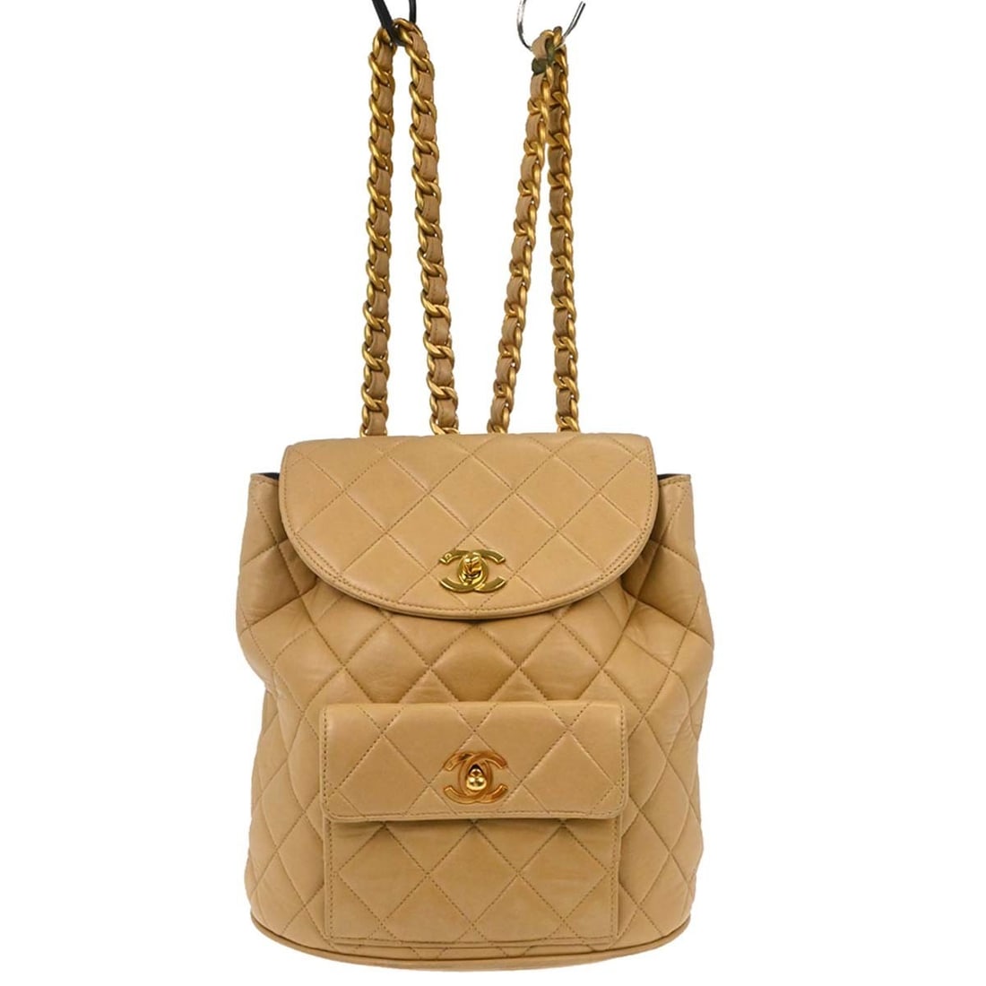 Beige Lambskin Small Backpack from Chanel Duma Collection: Beige Lambskin Small Backpack from Chanel Duma Collection This Chanel Duma backpack is crafted from beige lambskin leather and features a compact design with a turn lock closure. Designed for women, i