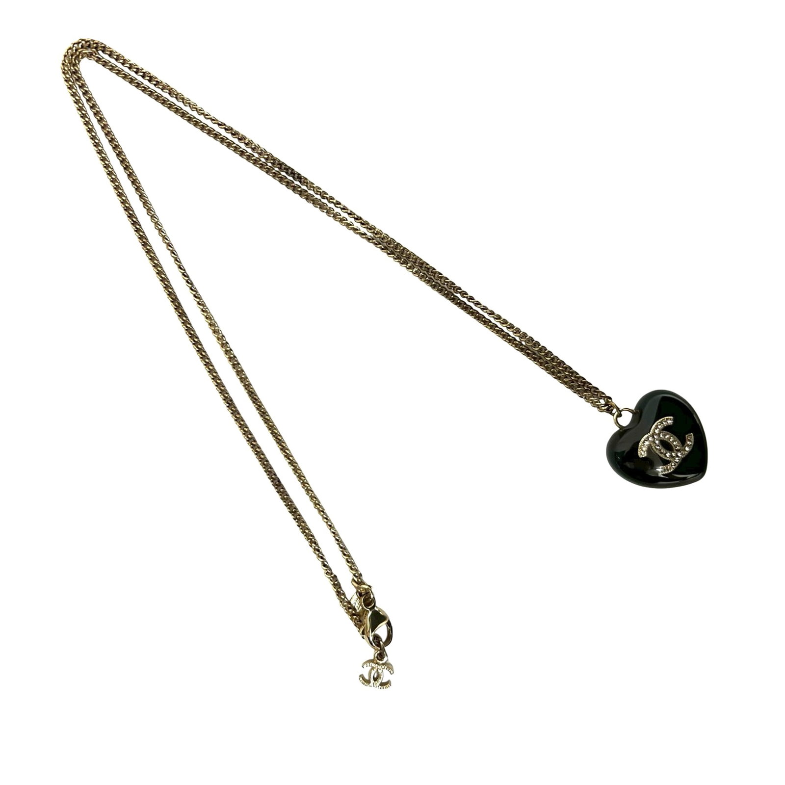 Chanel CC Pendant Necklace with Gold Plating Resin and Crystals: Chanel CC Pendant Necklace with Gold Plating Resin and Crystals This Chanel necklace features a gold plated chain with a black resin pendant adorned with crystal embellishments. The design includes a 