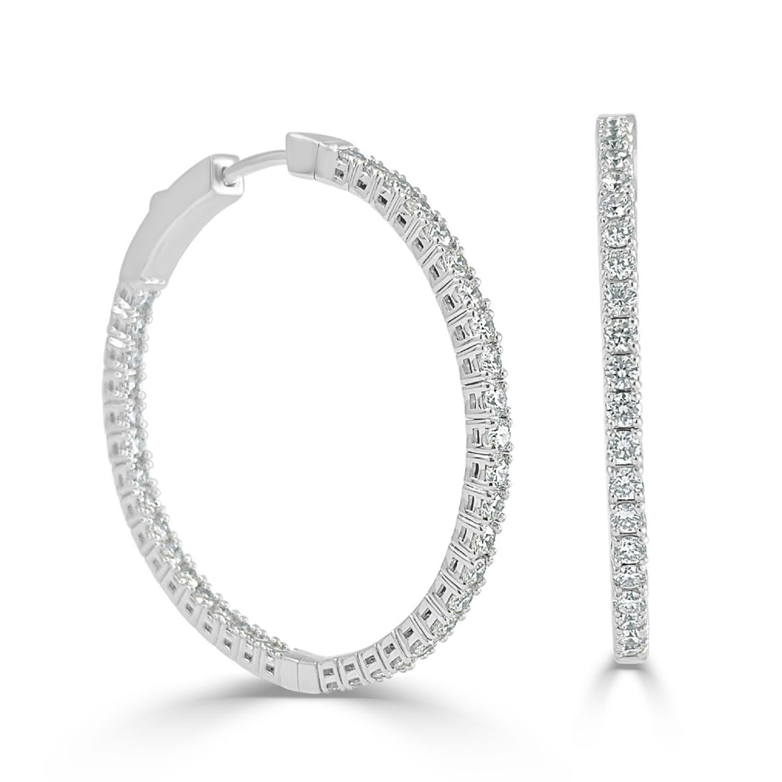 14K White Gold Hoop Earrings with 1.80 Carat Diamonds: 14K White Gold Hoop Earrings with 1.80 Carat Diamonds These flexible in & out hoop earrings are crafted from 14K white gold and feature round white diamonds totaling 1.80 carats. Designed for women, t