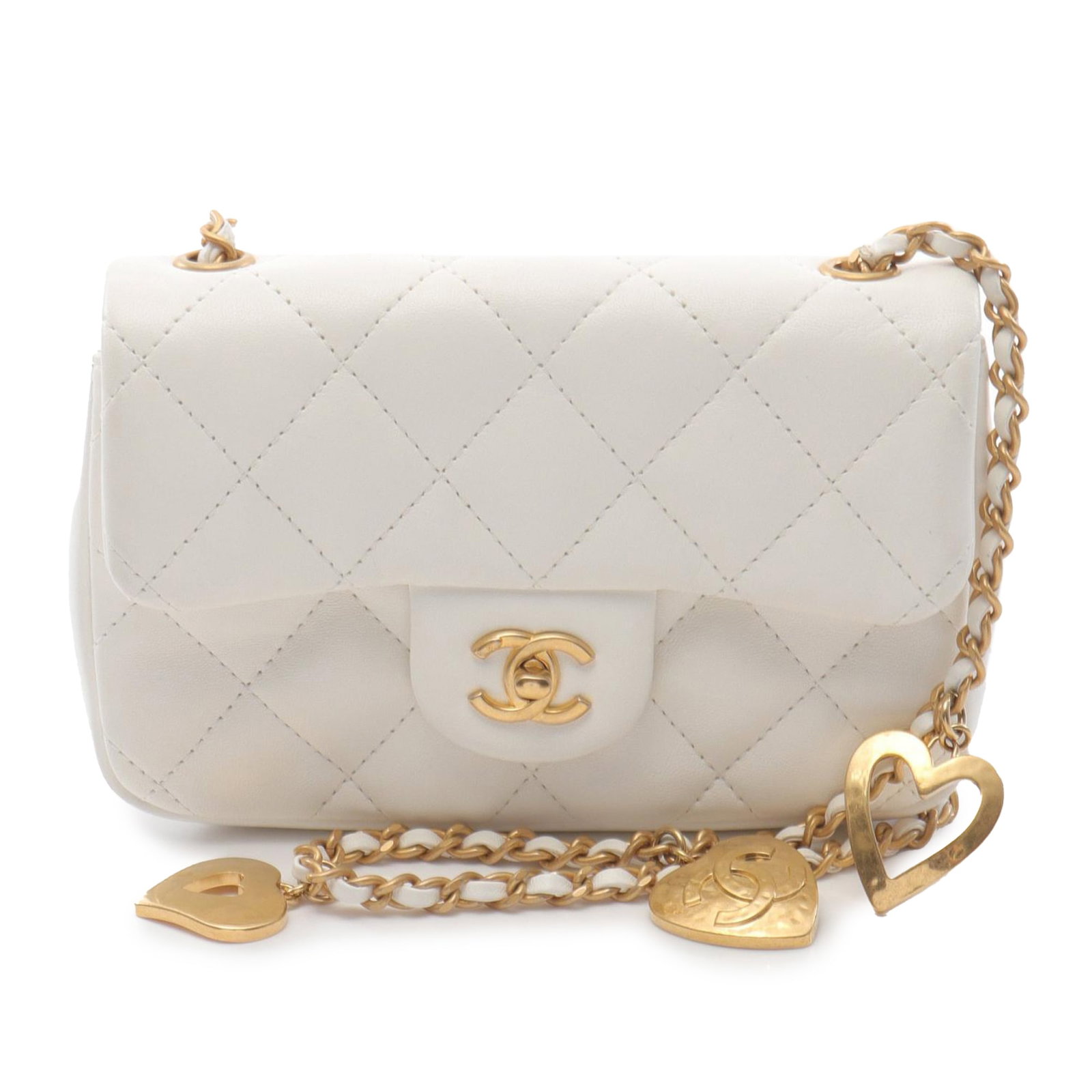 Chanel White Mini Flap Bag with Quilted Lambskin and Heart Charms: Chanel White Mini Flap Bag with Quilted Lambskin and Heart Charms This Chanel Mini Rectangular Quilted Lambskin Heart Charms Flap crossbody bag features a white lambskin leather body, a leather-woven 