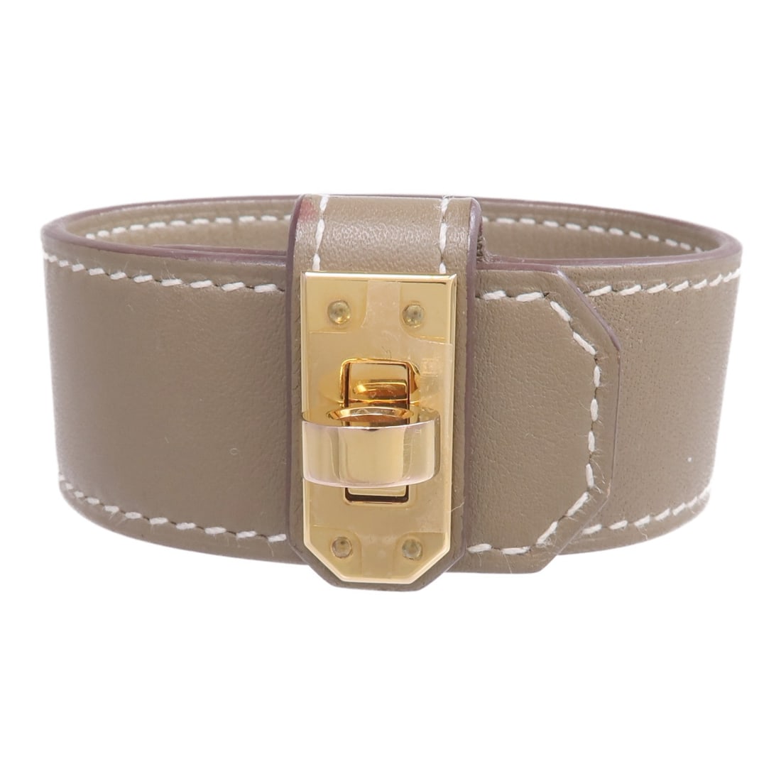 Hermes Kelly Twist Bracelet Etoupe Swift Leather with Gold Hardware: Hermes Kelly Twist Bracelet Etoupe Swift Leather with Gold Hardware This Hermes Kelly Twist bracelet features Swift leather in an Etoupe gray color. Designed for women, the bracelet is crafted from ca