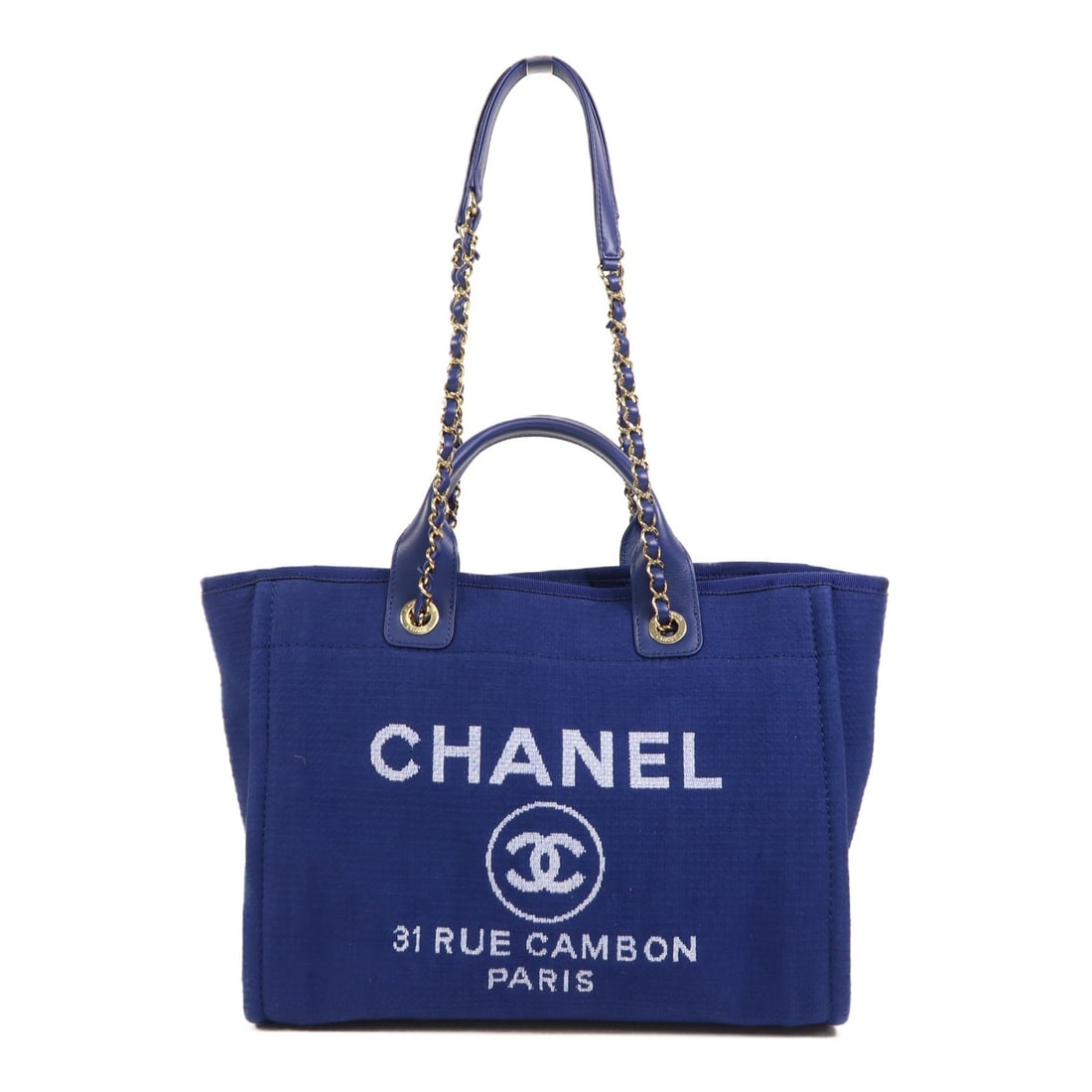 CHANEL Deauville Tote Blue Canvas 2 Way Shoulder Bag GHW: CHANEL Deauville Tote Blue Canvas 2 Way Shoulder Bag GHW Introducing the CHANEL CC GHW Deauville Tote, a versatile 2-way shoulder bag crafted from high-quality canvas in an elegant blue hue. This styl