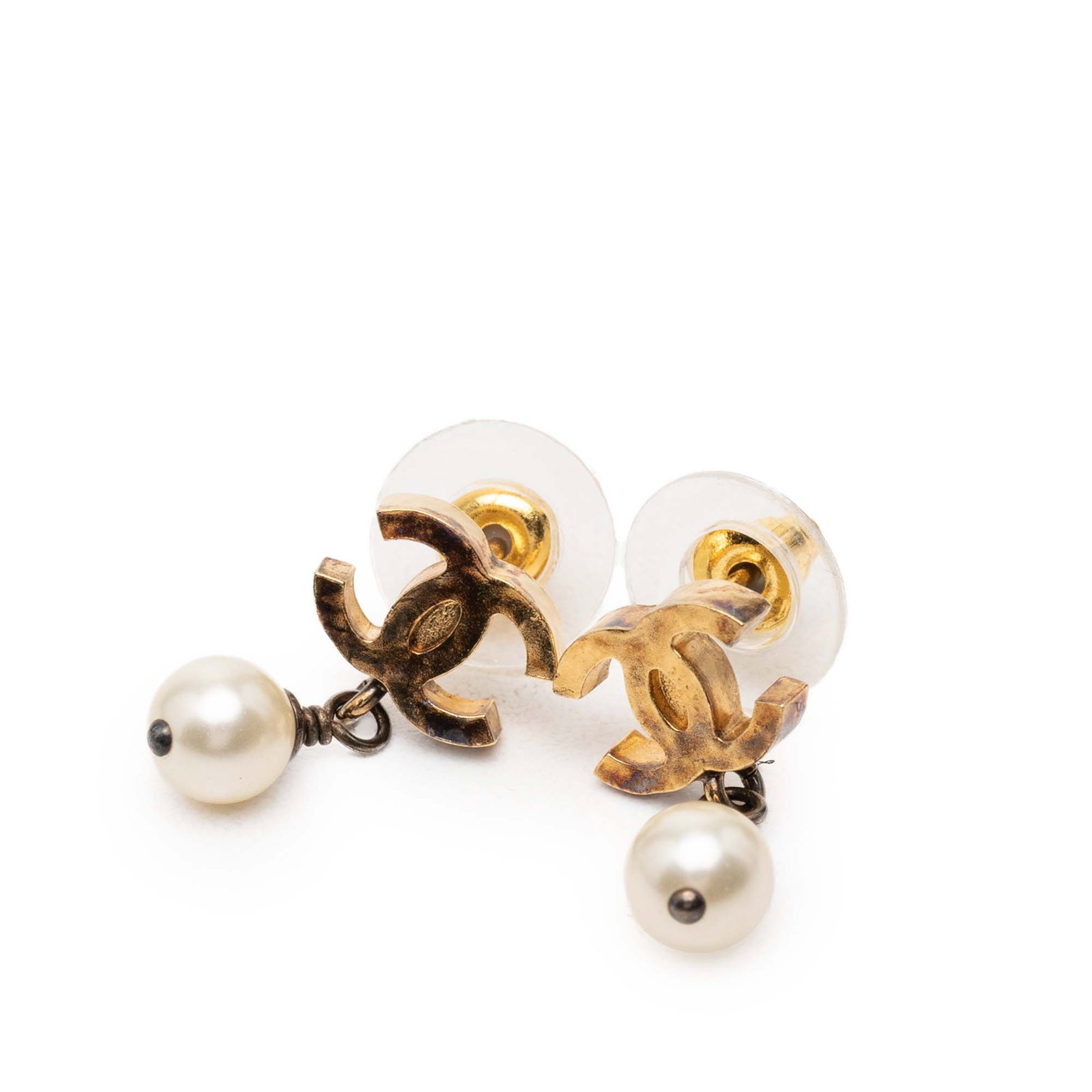 Chanel Faux Pearl Drop Earrings with Gold Plated Finish: Chanel Faux Pearl Drop Earrings with Gold Plated Finish These Chanel earrings showcase gold-plated metal bodies adorned with faux pearl embellishments and feature secure push back closures. Designed i