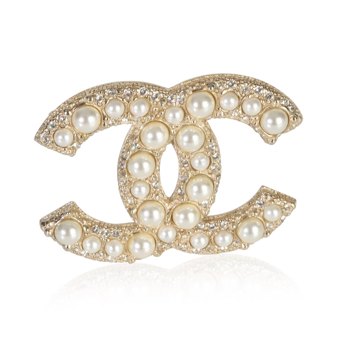 2022 Chanel CC Brooch with Faux Pearl and Strass Gold Plated Finish: 2022 Chanel CC Brooch with Faux Pearl and Strass Gold Plated Finish This Chanel brooch from the 2022 Faux Pearl & Strass CC collection features a gold-plated finish and is designed for unisex wear. Th