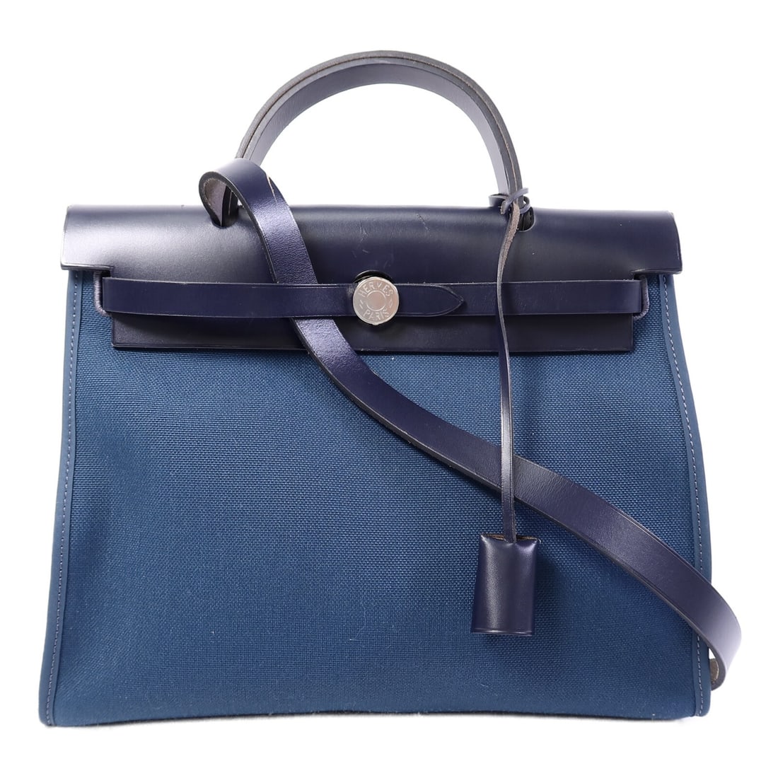 Hermes Herbag PM Blue Calfskin Canvas Shoulder Tote: Hermes Herbag PM Blue Calfskin Canvas Shoulder Tote This Hermes Herbag PM is a versatile 2-way shoulder bag crafted from calfskin and canvas in a striking combination of ocean blue and blue indigo. De