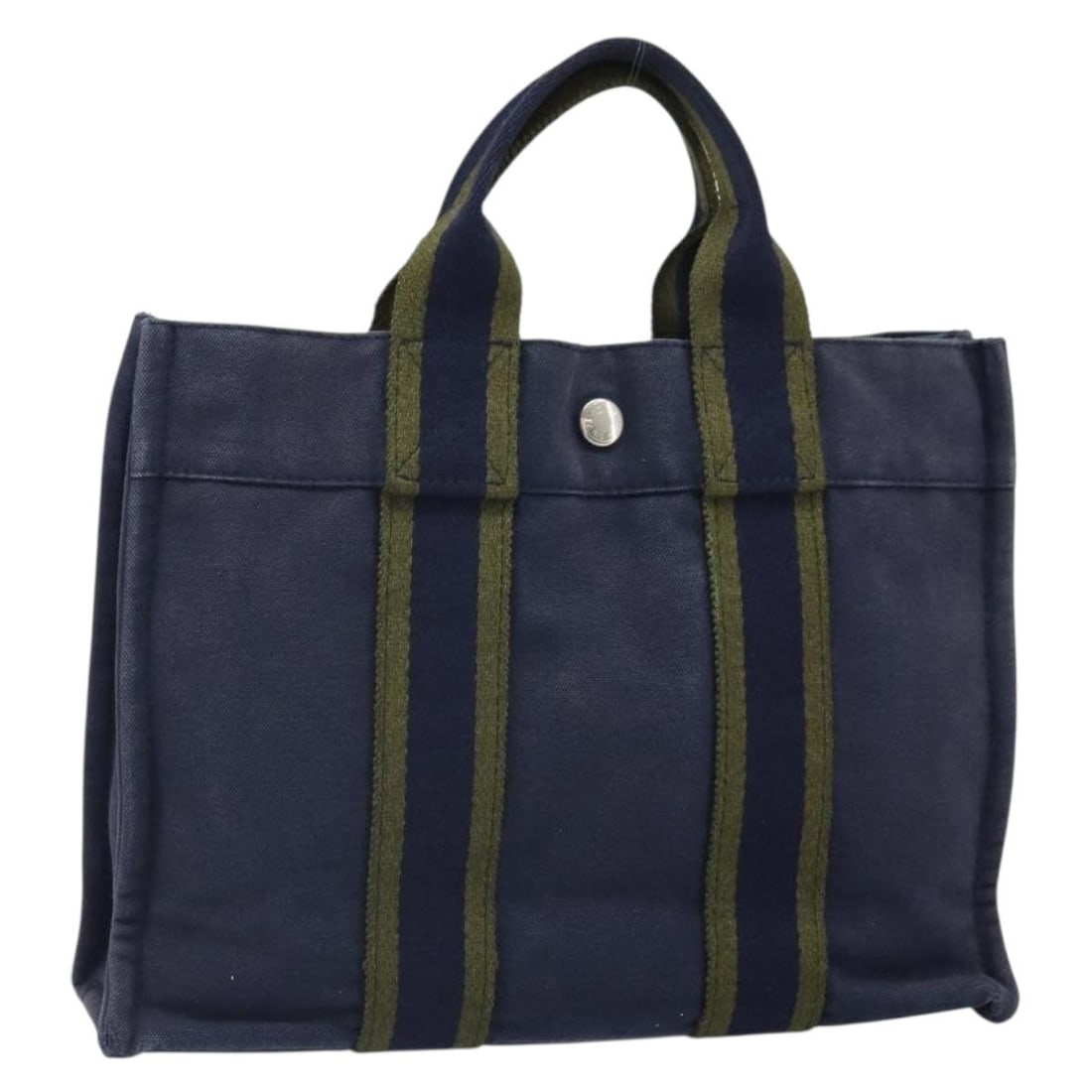 Hermes Fourre ToutPM Navy Canvas Hand Bag Made in France: Hermes Fourre ToutPM Navy Canvas Hand Bag Made in France This Hermes Fourre Tout PM handbag features a navy canvas exterior with leather accents. The bag shows signs of heavy use, including surface ru
