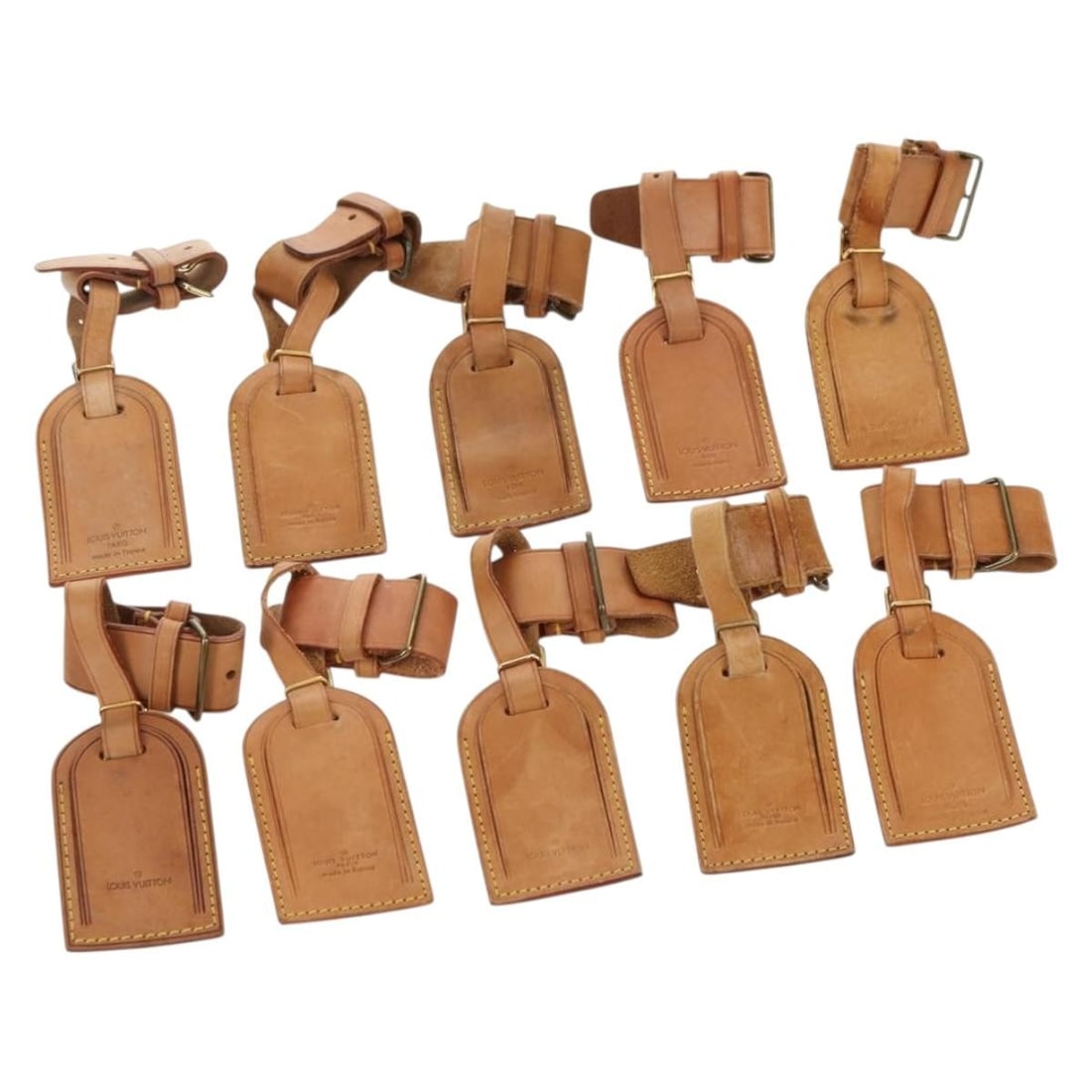 Louis Vuitton leather beige name tags 10-piece set: Louis Vuitton leather beige name tags 10-piece set This is a set of ten LOUIS VUITTON Powanie name tags crafted from beige leather. Designed for women and made in France, these name tags display notab